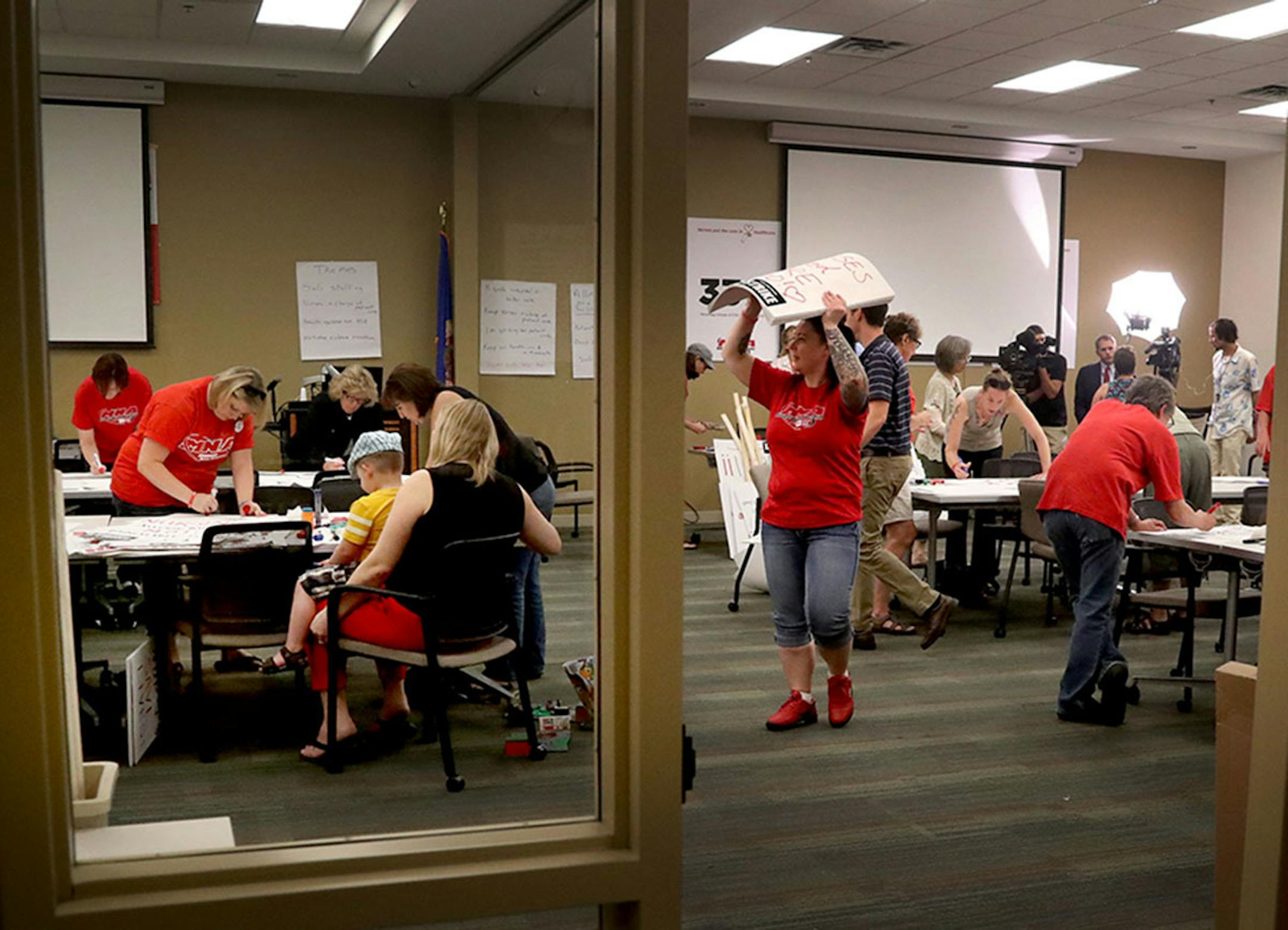 MNA nurses, Minnesota Nurses Association employees and family members joined forces at the MNA headquarters to make posters for picketing Saturday, June 18, 2016, should a strike happen Sunday at five Twin Cities Allina Health facilities.