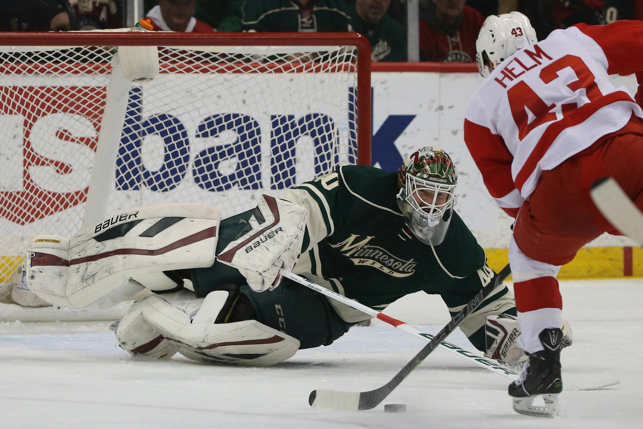 Wild's goalie Cevan Dubnyk came out of the net to make a stop with Red Wing's Darren Helm skating hard on a break away that would have been a short handed goal during the first period. ] (KYNDELL HARKNESS/STAR TRIBUNE) kyndell.harkness@startribune.com Wild ve Red Wings at the Xcel Energy Center in St. Paul Min., Saturday, April 4, 2014.