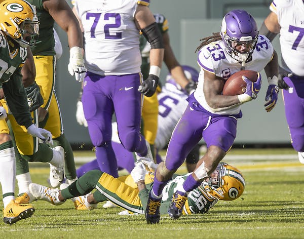 Vikings running back Dalvin Cook plowed through the Green Bay defense for 163 yards rushing on Sunday at Lambeau Field.