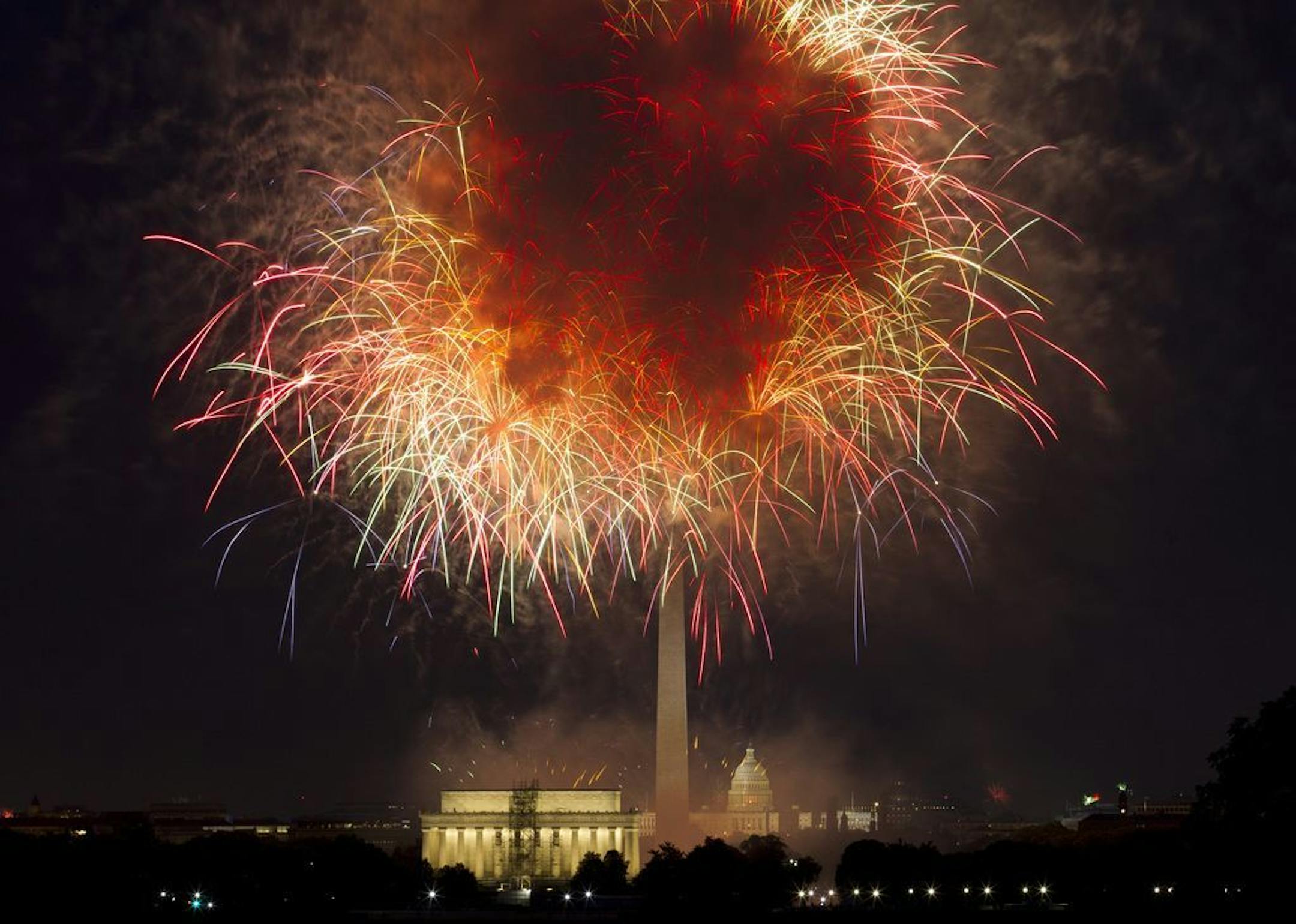 FILE - In this July 4, 2018, file photo, fireworks explode over Lincoln Memorial, Washington Monument and U.S. Capitol, along the National Mall in Washington, during the Fourth of July celebration. Independence Day is just over three weeks away, and nobody in Washington seems to know exactly what the July 4 celebrations in the nation's capital will look like. President Donald Trump has stated he wants to reshape the annual event into a "Salute to America" that would feature Trump himself speakin