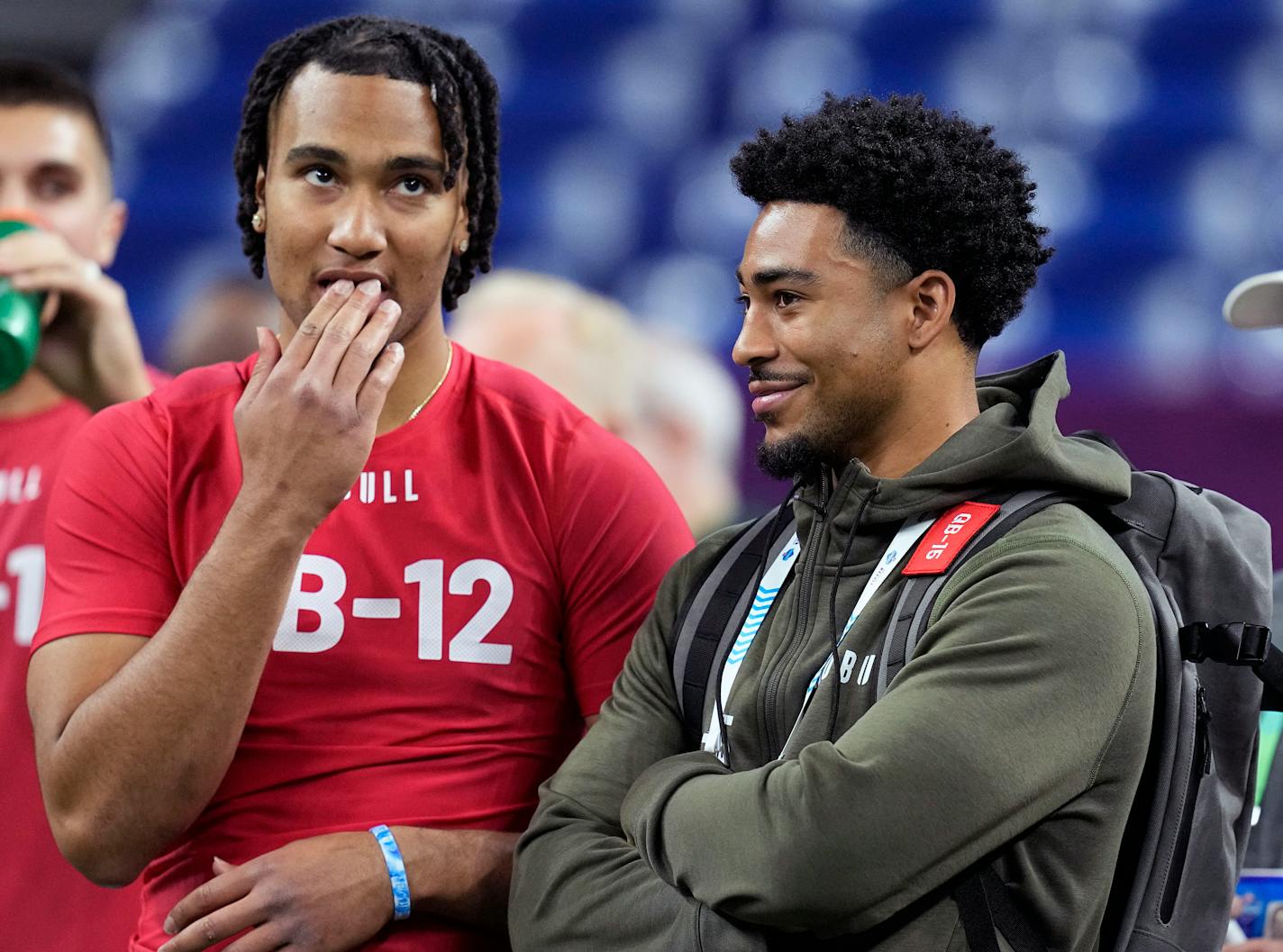 FILE - Ohio State quarterback CJ Stroud, left, talks to Alabama quarterback Bryce Young at the NFL football scouting combine in Indianapolis, Saturday, March 4, 2023. The Panthers packaged two first-round picks, two second-round picks and star receiver D.J. Moore to move up from No. 9 in the draft to the top pick to give Carolina the pick of the lot at quarterback in next week's draft. (AP Photo/Darron Cummings, File)