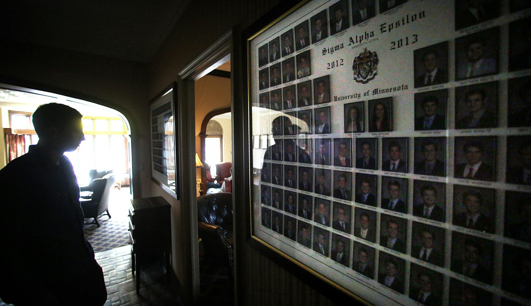 The reflection of current Sigma Alpha Epsilon U of M chapter president Brad Otto, Brooklyn Park, was cast in the glass covering photographs of members from 2012-2013. ] JIM GEHRZ ‚Ä¢ jgehrz@startribune.com / Minneapolis, MN / March 12, 20134/ 2:00 PM - BACKGROUND INFORMATION: The national fraternity Sigma Alpha Epsilon recently banned pledging in hopes to save lives and end pledging as a whole in the future. University of Minnesota's SAE chapter provides a local perspective.
