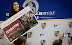 St. Michael-Albertville High basketball star Tessa Johnson, Minnesota's top-ranked girls basketball recruit, holds up a sign as she poses for photos a