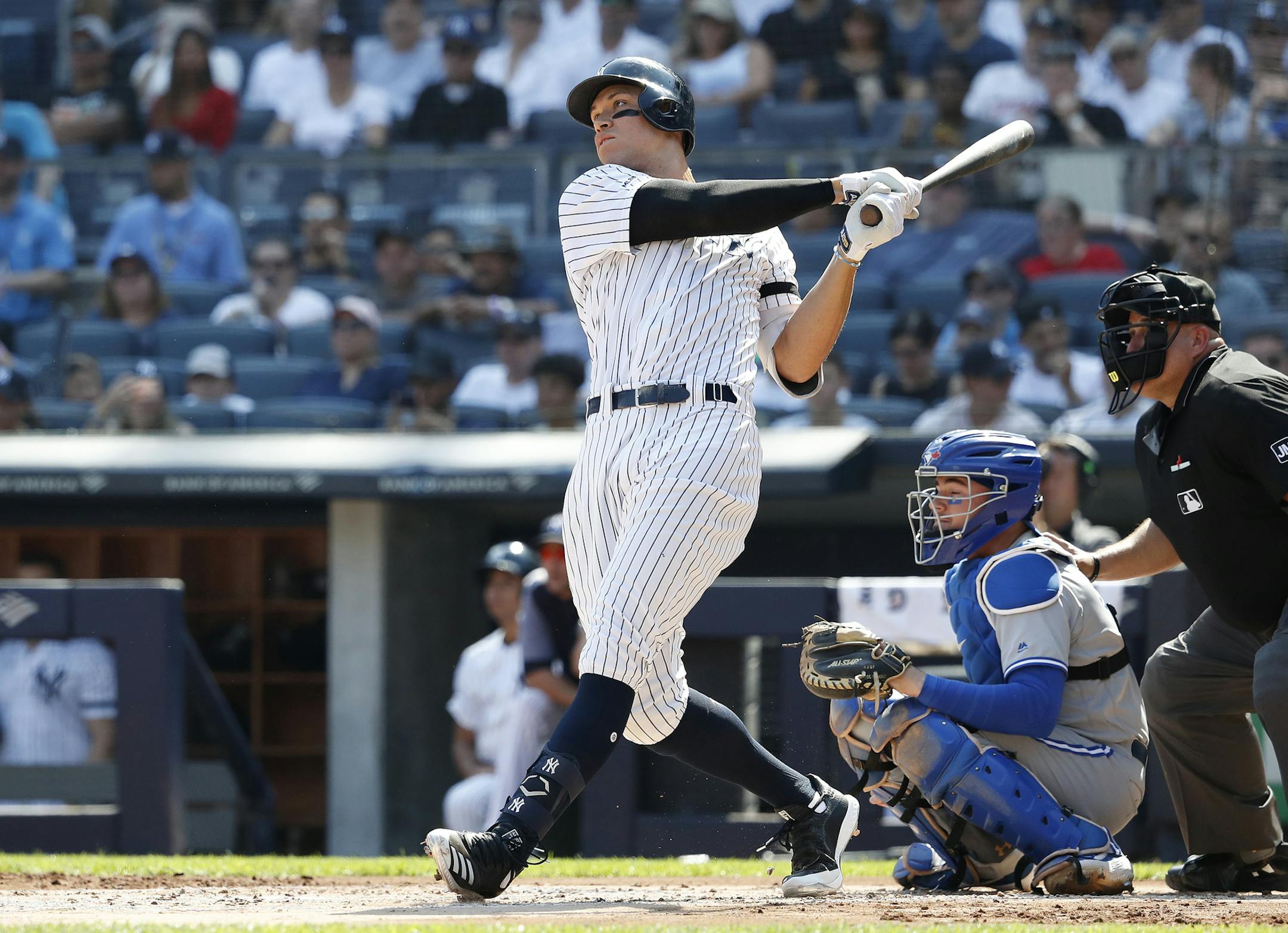 New York Yankees' Aaron Judge hits a home run against the Toronto Blue Jays during the first inning of a baseball game, Sunday, Sept. 22, 2019, in New York. (AP Photo/Michael Owens)