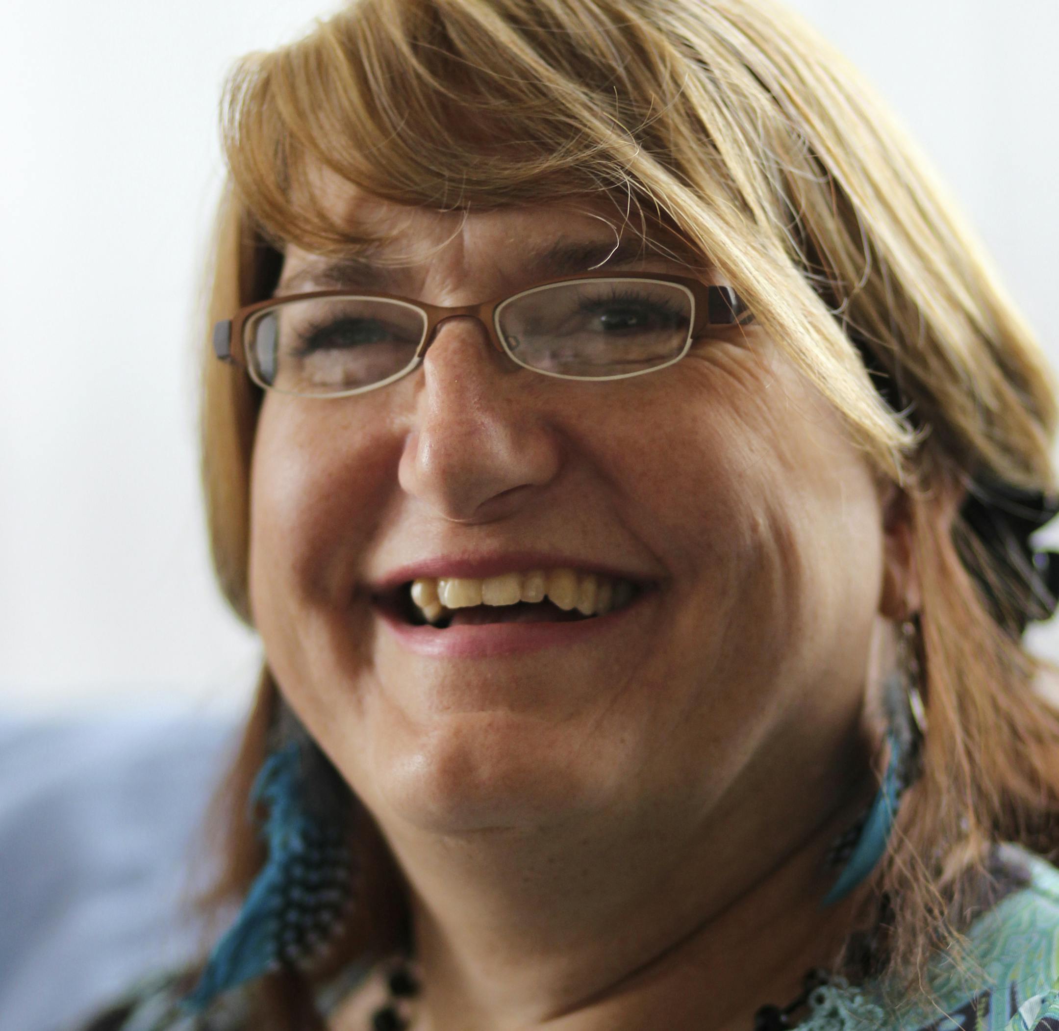 Kimberly Walker at her residence Saturday, June 8, 2013, in St. Paul, MN.](DAVID JOLES/STARTRIBUNE) djoles@startribune.com Tim/Kimberly Walker, a dual-gender person who lives and works under both identities (using a two-sided business card.