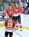 Chicago Blackhawks right wing Marian Hossa of Slovokia, left to right, center Jonathan Toews and left wing Brandon Saad celebrate Saad's goal during t