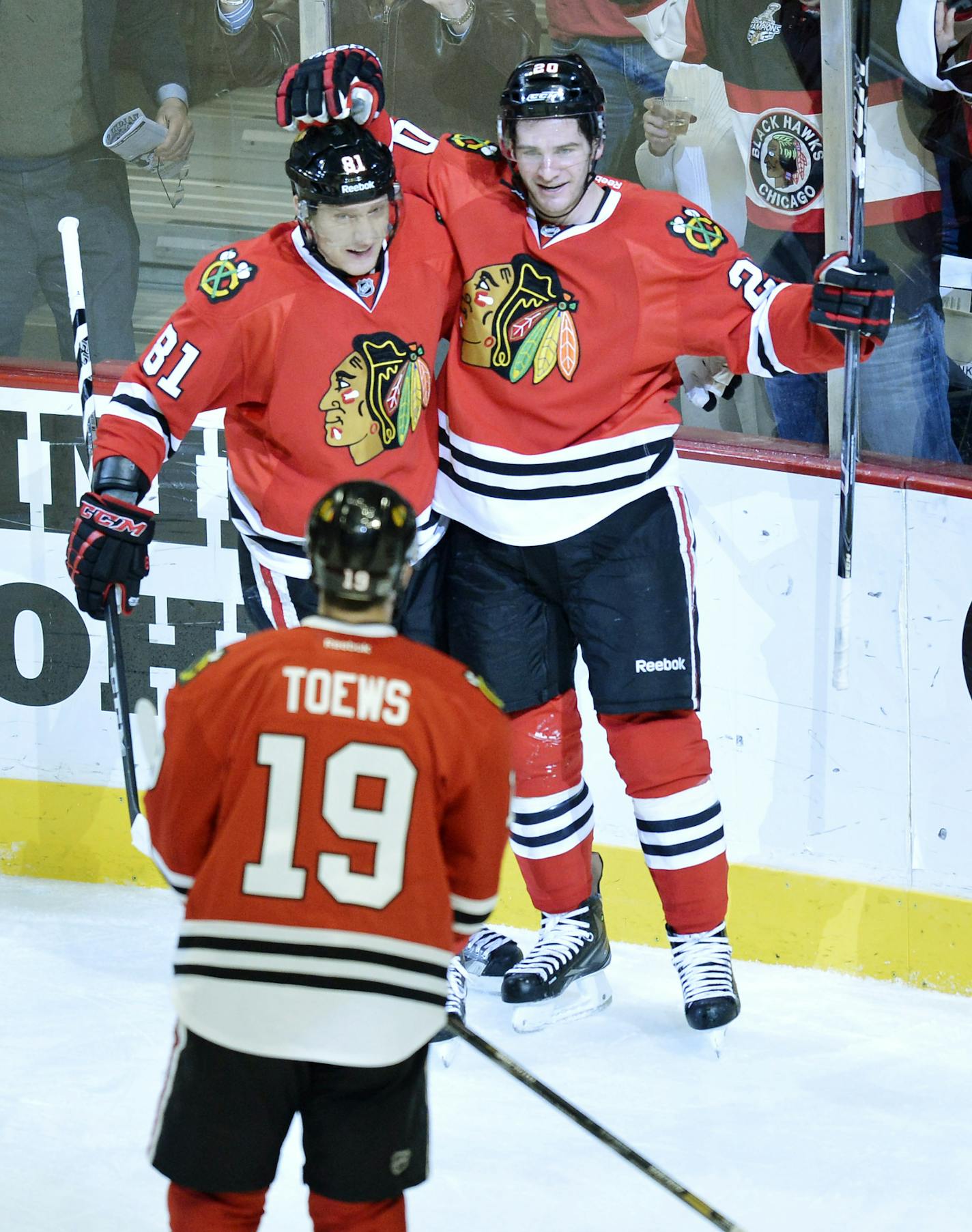 Chicago Blackhawks right wing Marian Hossa of Slovokia, left to right, center Jonathan Toews and left wing Brandon Saad celebrate Saad's goal during the first period of an NHL hockey game against the Minnesota Wild, Tuesday, March 5, 2013 in Chicago. (AP Photo/Brian Kersey)