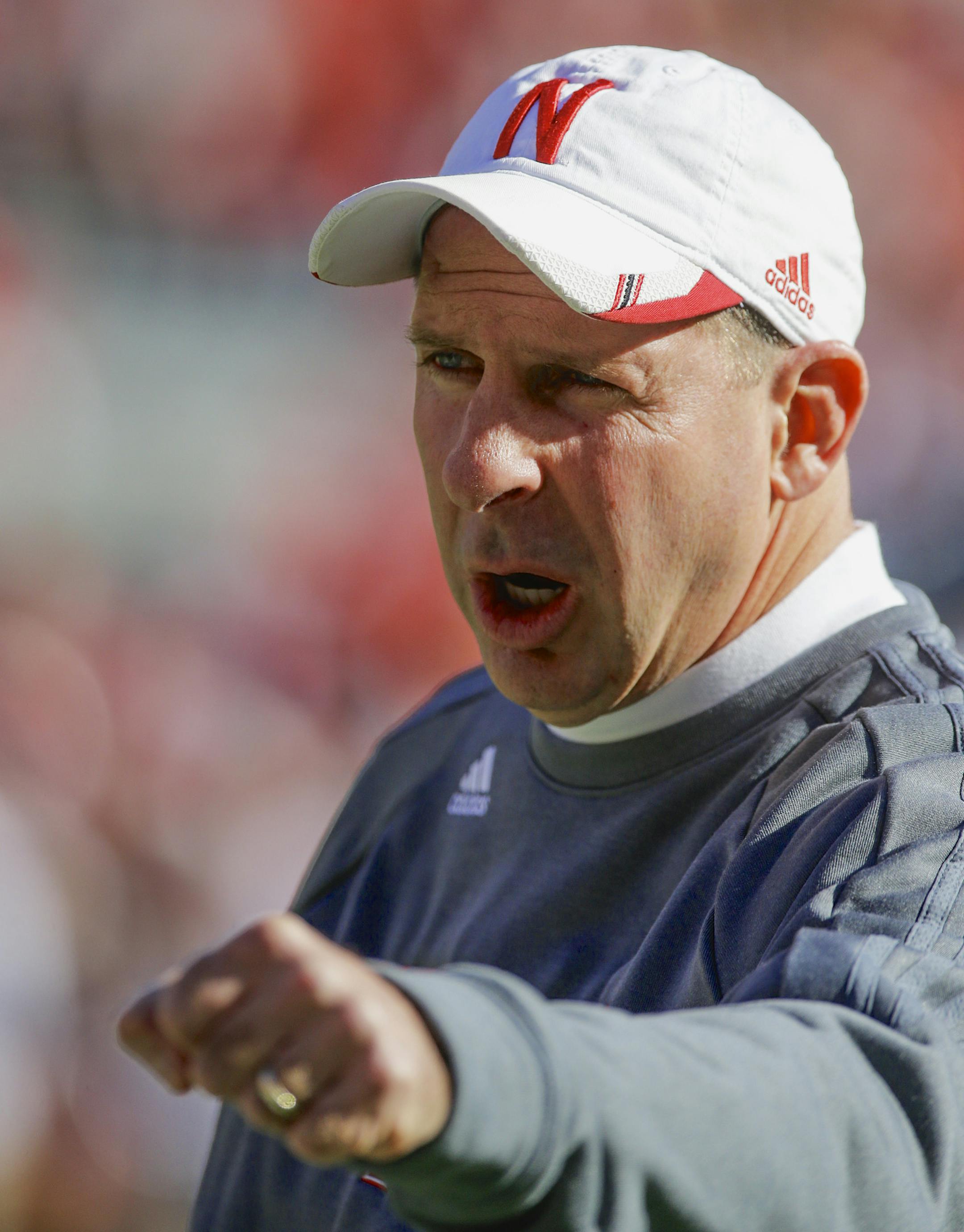 Nebraska head coach Bo Pelini bumps fists prior to an NCAA college football game against Northwestern in Lincoln, Neb., Saturday, Nov. 2, 2013. (AP Photo/Nati Harnik) ORG XMIT: NENH10
