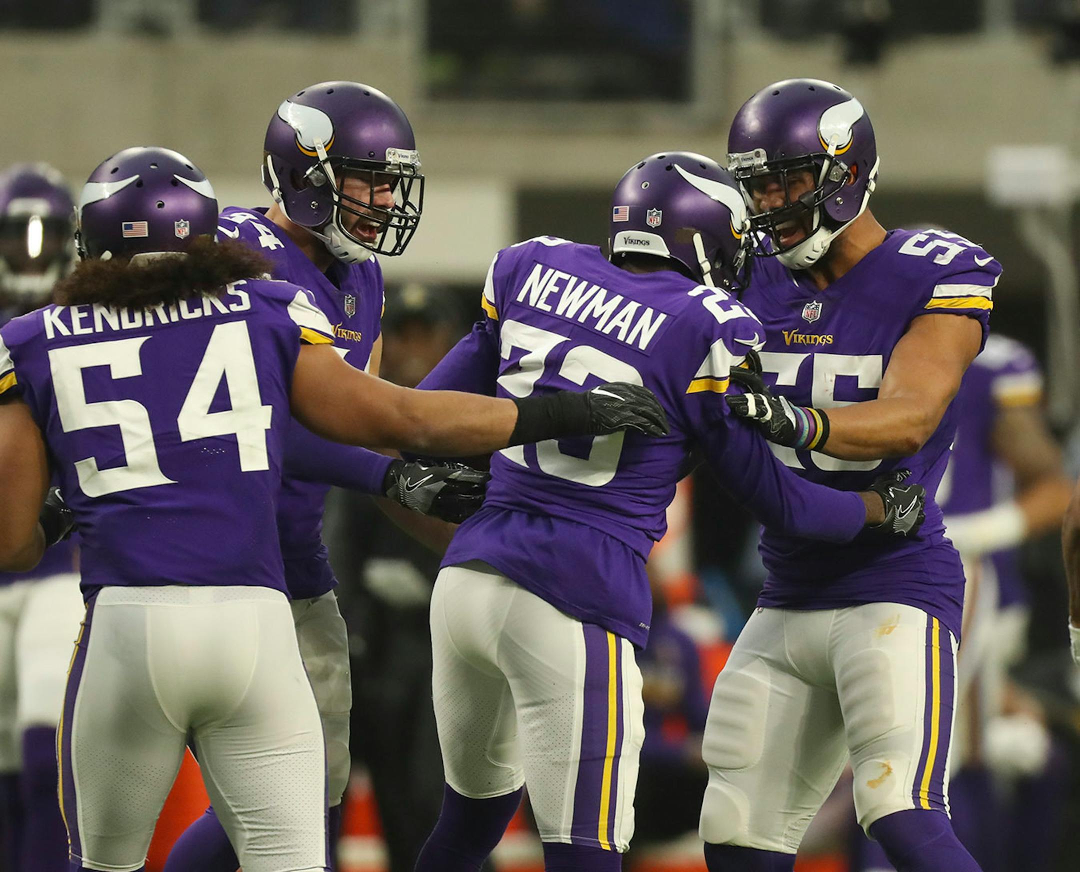 Minnesota Vikings cornerback Terence Newman (23) was congratulated by teammates, including Vikings outside linebacker Anthony Barr (55).