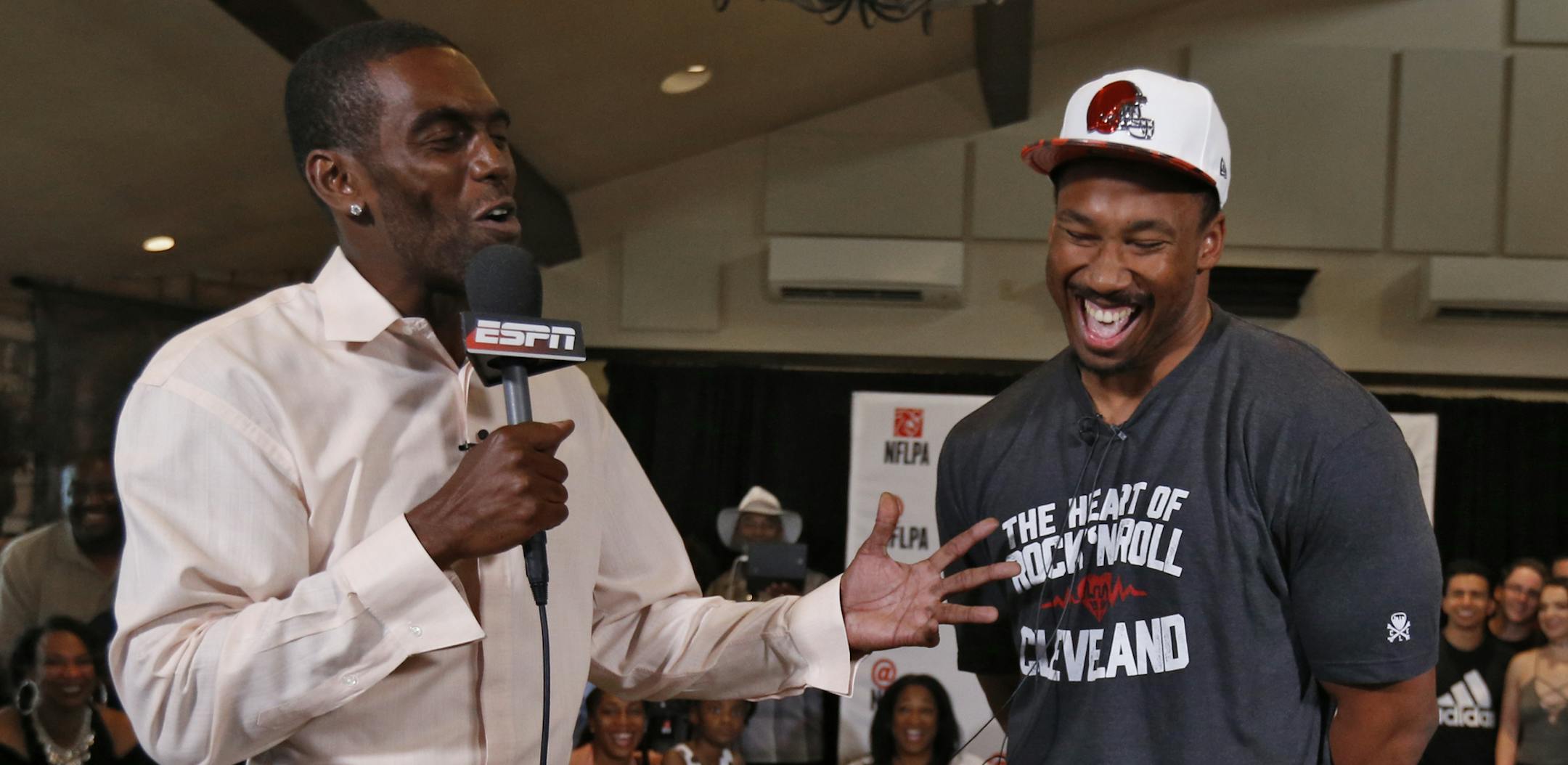Randy Moss, left, of ESPN, interviews Texas A&M's Myles Garrett, who was selected as the No. 1 pick in the NFL football draft, at Terre Verde Golf Course in Arlington, Texas, Thursday, April 27, 2017. (Nathan Hunsinger/The Dallas Morning News via AP)