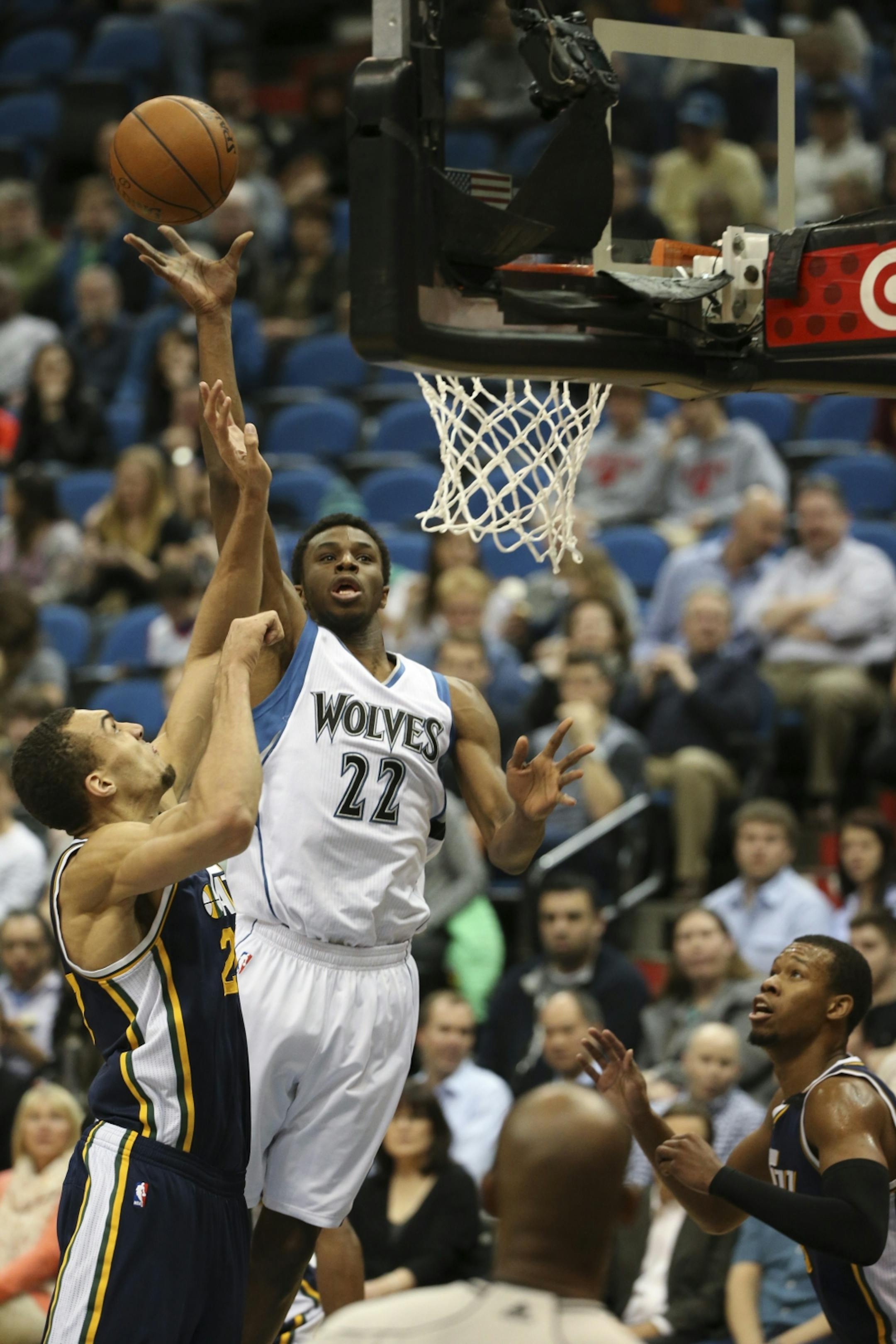 Minnesota Timberwolves forward Andrew Wiggins took a first quarter shot over Utah Jazz center Rudy Gobert Monday night at Target Center.