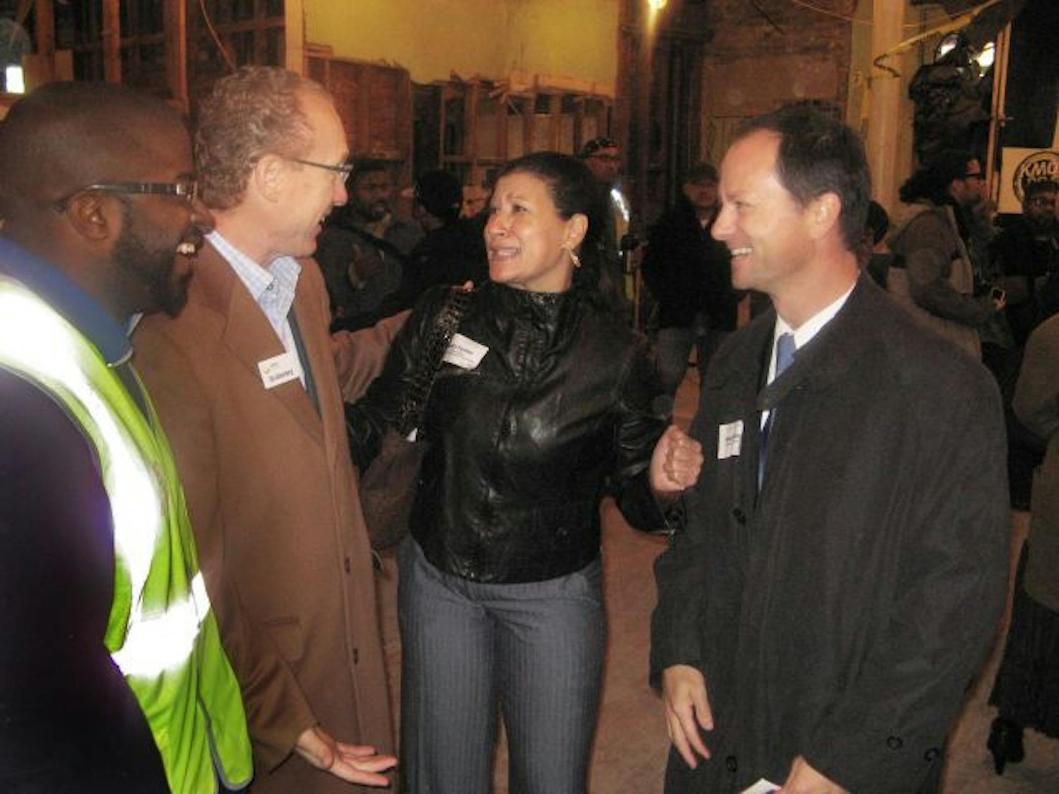 Calvin Littlejohn, president of Tri Construction; developer Stuart Ackerberg of Catalyst Community Partners; Sarita Turner, executive director of the West Broadway Business & Area Coalition; and banker Dave Reiling discuss the $2.6 million conversion of a decades-abandoned complex at Penn Avenue and W. Broadway Av. into a new home for KMOJ Radio.