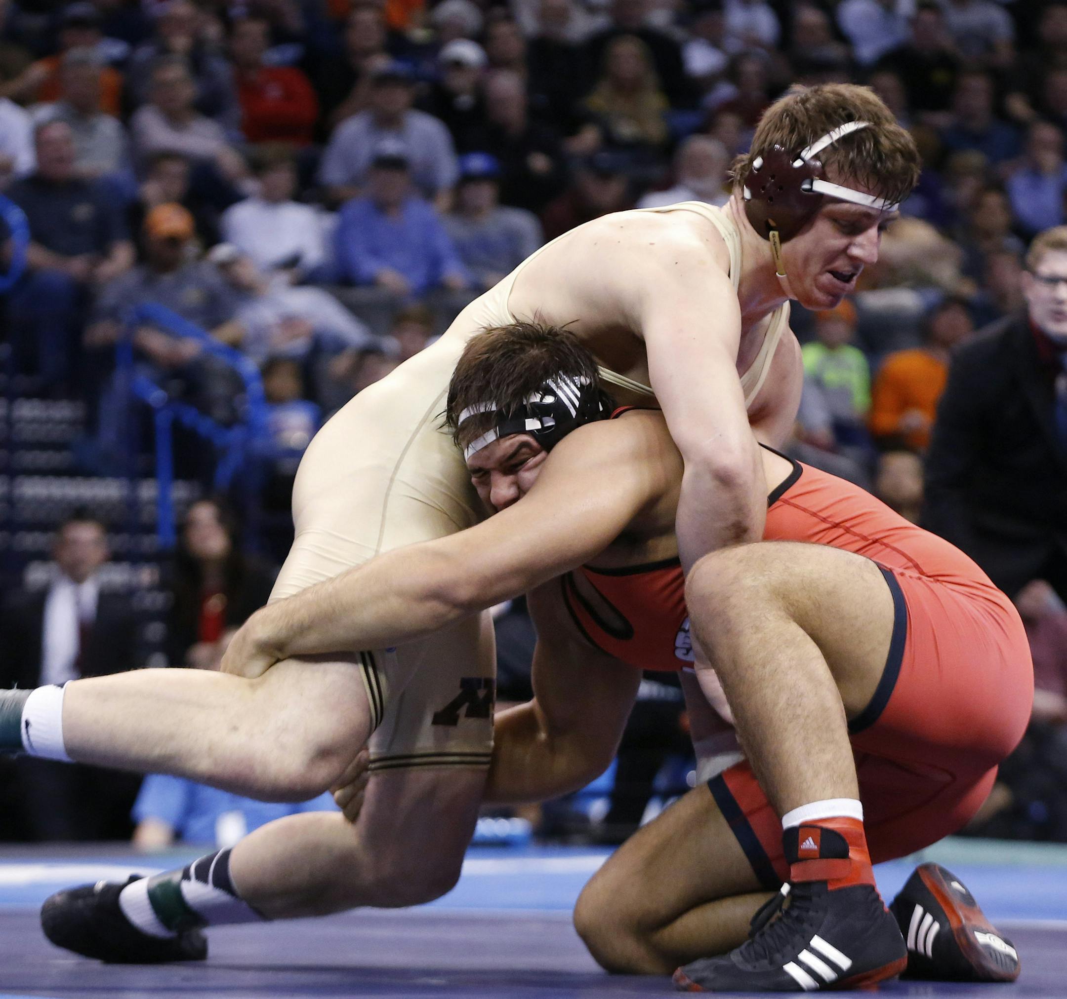 Minnesota's Anthony Nelson, top, wrestles North Carolina State's Nick Gwiazdowski, bottom, in the 285-pound match in the finals of the NCAA Division I wrestling championships in Oklahoma City, Saturday, March 22, 2014. Gwiazdowski won the match and the championship. (AP Photo/Sue Ogrocki) ORG XMIT: OKSO