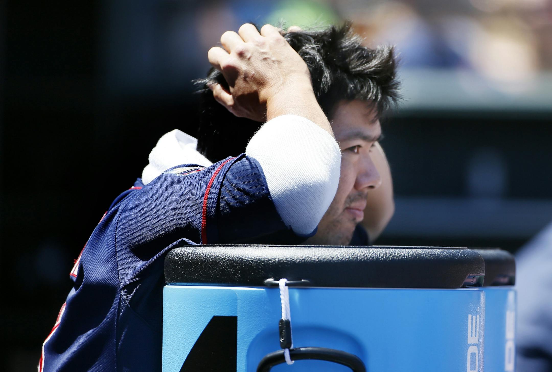 Twins catcher Kurt Suzuki watched the action from the dugout during Sunday's 8-1 loss to the Giants.