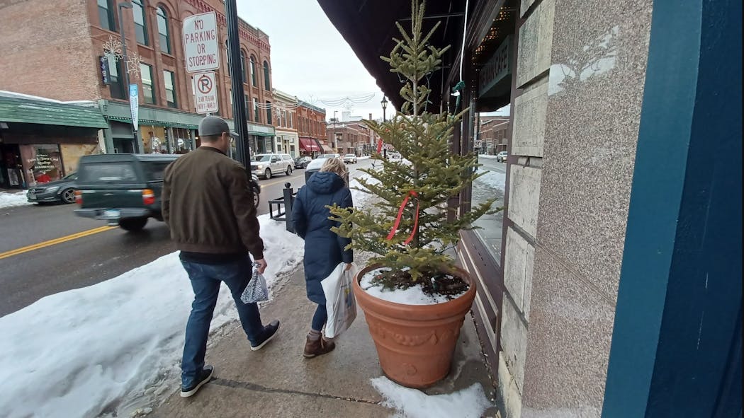 Friends and supporters of the family of George Musser, the 20-year-old Stillwater man found dead on Christmas Day, have been tying red ribbons in his memory, such as these along Main Street.