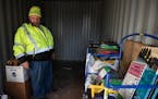 Robert Weikle Jr. looked through the metal storage unit in his driveway that he and his wife Diane have used over the years to store toys for their an