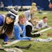 Minnetonka High School senior Lily Hohag volunteered to help teach young girls to play Lacrosse on a Saturday morning in February. ] Shari L. Gross &#