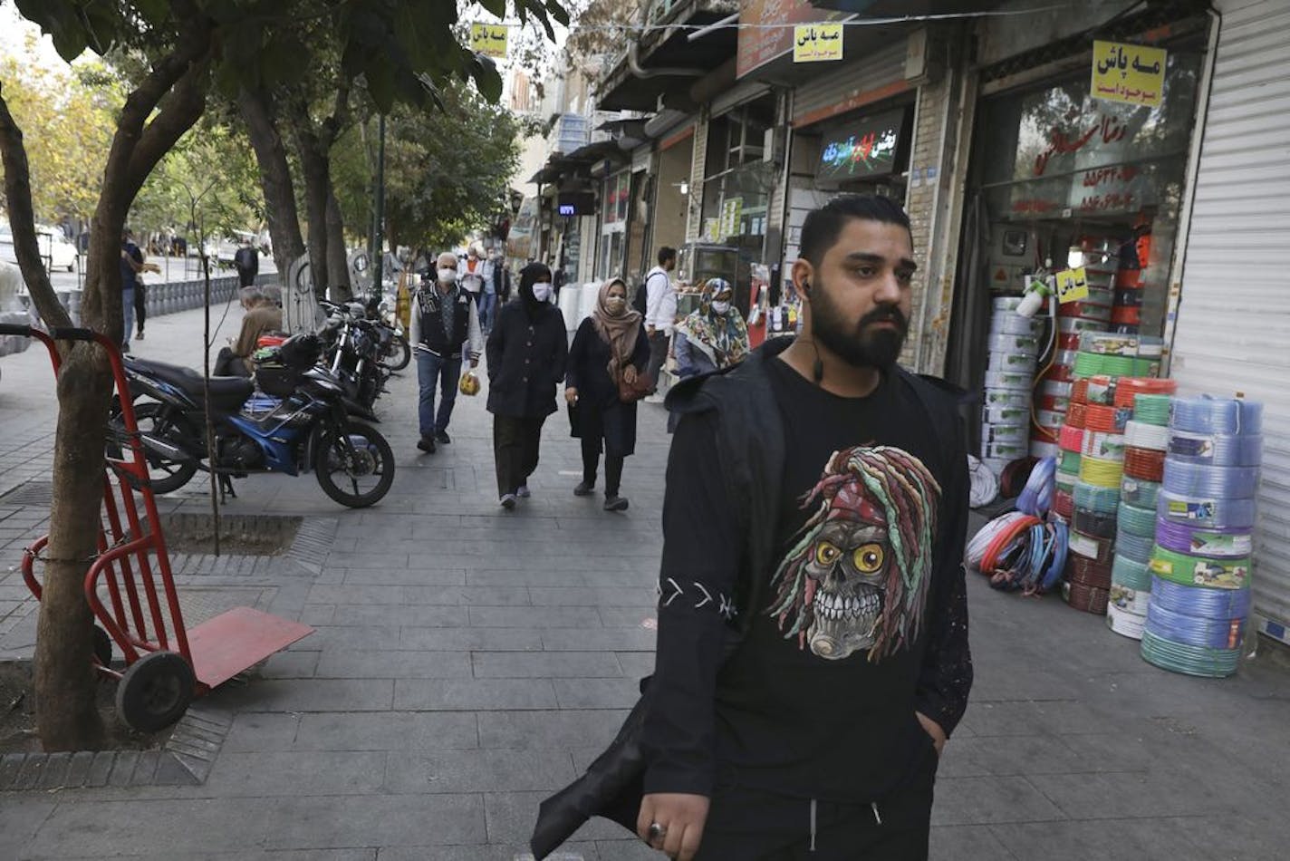 People walk around Tehran's Grand Bazaar, Iran, Sunday, Nov. 8, 2020. Iranians welcomed the election of Joe Biden as the 46th President of the United States as a beacon of hope for the future of their country already battered by the most severe sanctions in its history.