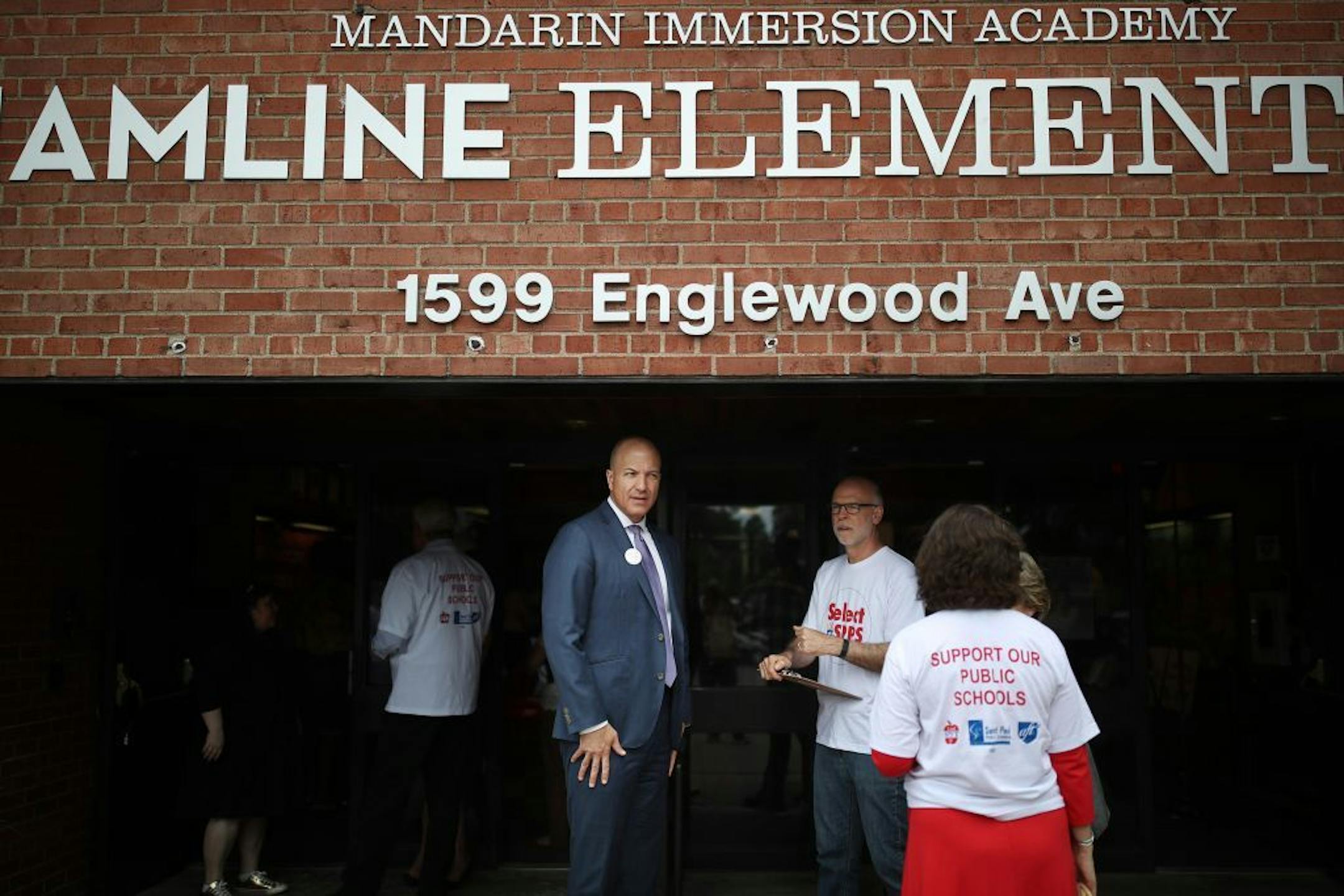 St. Paul Superintendent Joe Gothard left, and SPFT President Nick Faber talked outside of Hamline Elementary School Thursday June 21, 2018 in St. Paul, MN. In an effort to address enrollment and budget woes, the St. Paul school district is joining forces with the local teacher's union to go door-knocking to sell the St. Paul public schools to families with school-age children