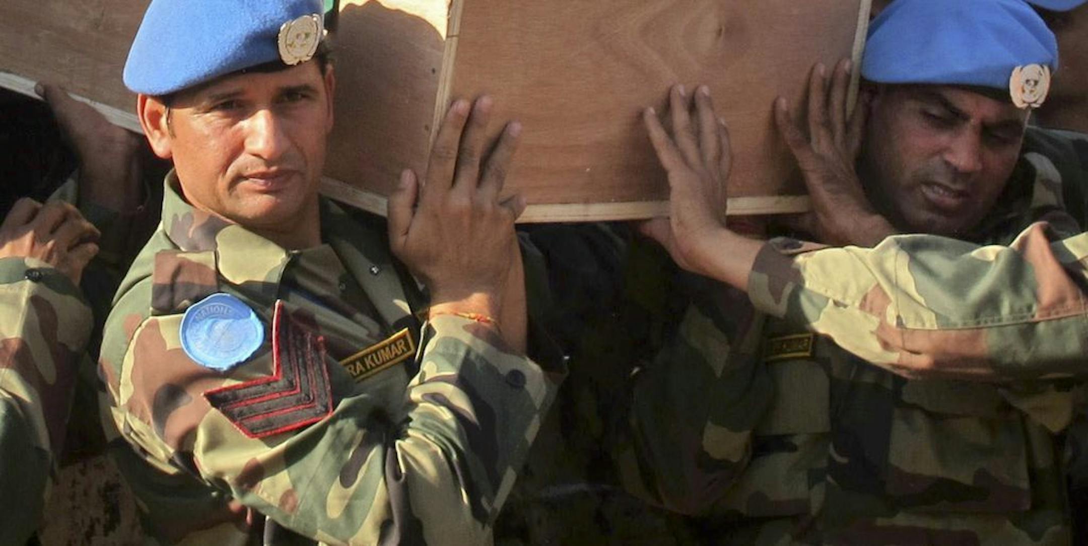 In this photo released by the United Nations Mission in South Sudan (UNMISS), the remains of two Indian U.N. peacekeepers who were killed Thursday arrive back at the airport in Juba, South Sudan Friday, Dec. 20, 2013. The U.N. peacekeeping mission in South Sudan says two Indian peacekeepers were killed at their base when armed youths breached the U.N. compound in Akobo, Jonglei state, and called "on all parties to the crisis to refrain from further violence and seek a peaceful resolution".