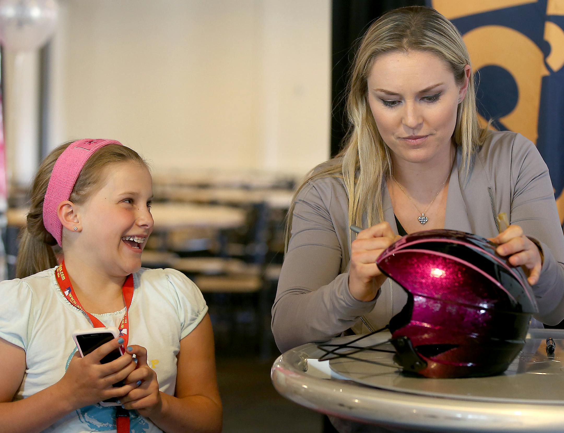 Graduate Zora Hynnek, 9, was more than thrilled to get her ski helmet signed by American World Cup alpine ski racer Lindsey Vonn at Afton Alps, Wednesday, April 1, 2015 in Afton, MN. ] (ELIZABETH FLORES/STAR TRIBUNE) ELIZABETH FLORES &#x2022; eflores@startribune.com