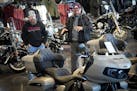 Lloyd Greer, left, talked with customer and Indian motorcycle owner Tony Hines who stopped by to purchase some parts and to view the showroom offering