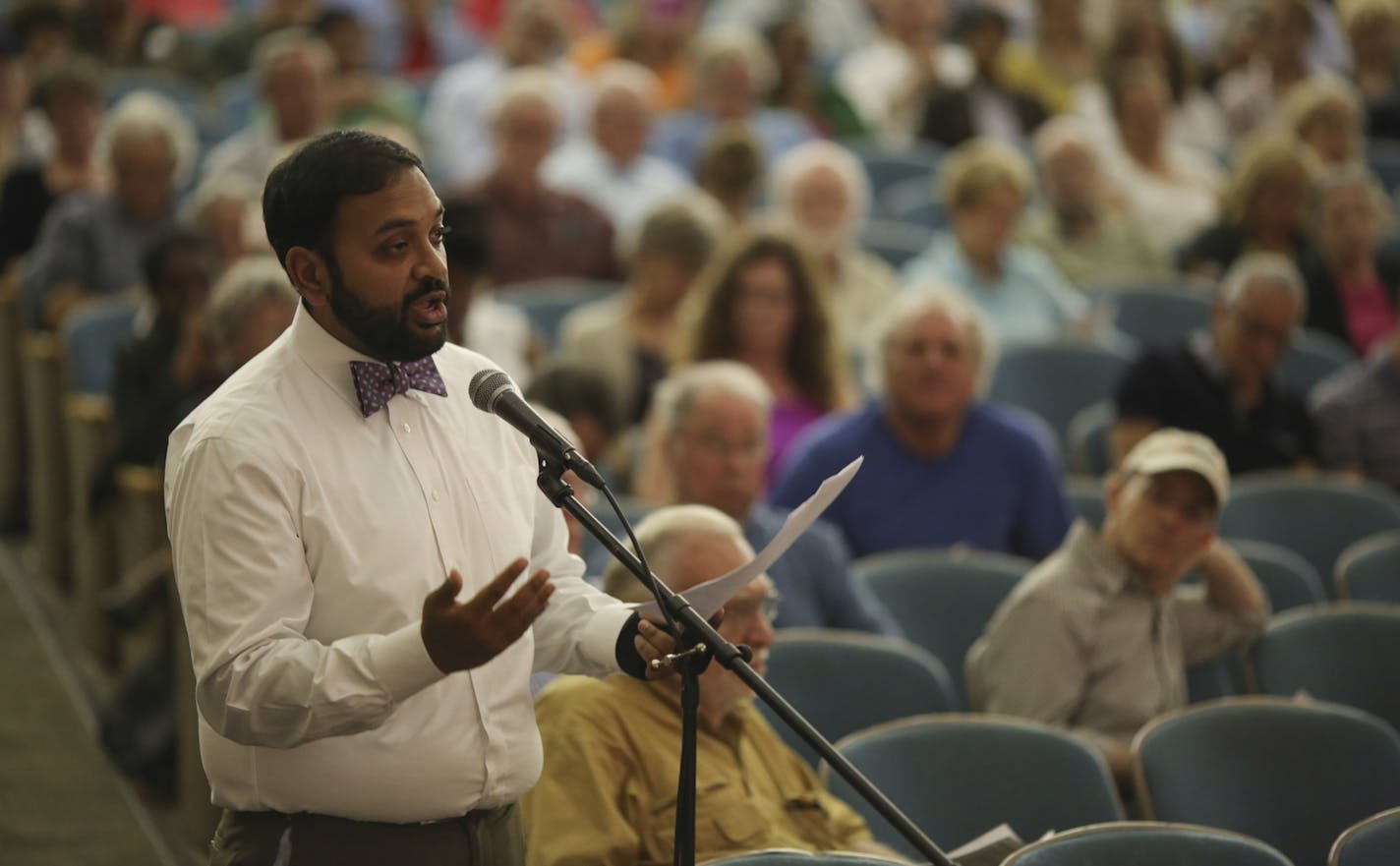 Avi Viswanathan offered comment on behalf of Hire Minnesota at the community meeting to take comment on the Southwest Light Rail project Tuesday night at Anwatin Middle School in Minneapolis. ] JEFF WHEELER &#x201a;&#xc4;&#xa2; jeff.wheeler@startribune.com A community meeting was held at Anwatin Middle School Tuesday night, July 8, 2014 to discuss the Southwest Light Rail project.