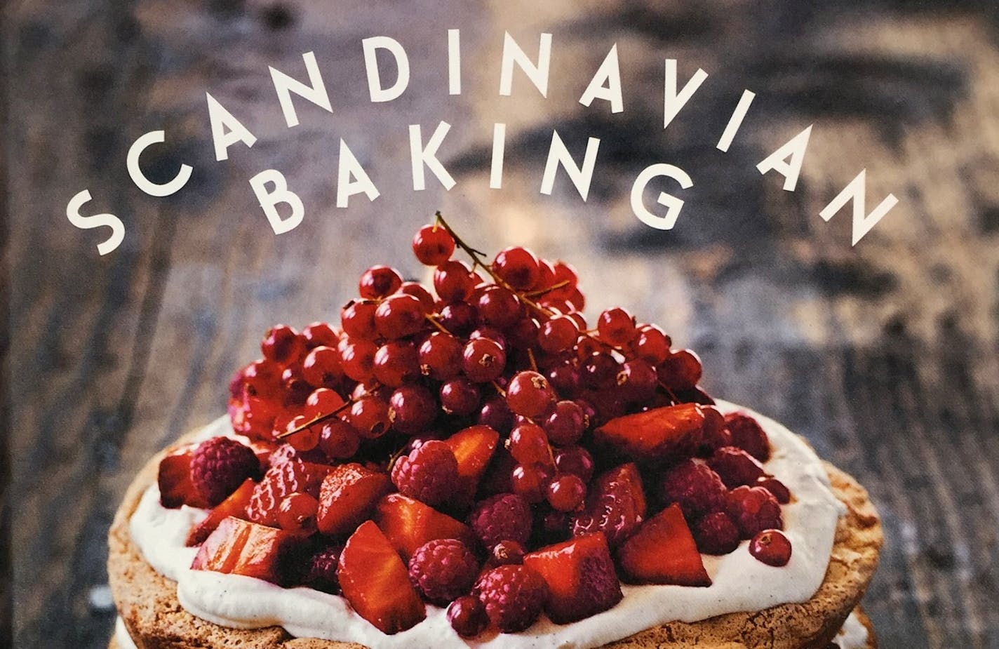 "Scandinavian Baking, Sweet and Savory Cakes and Bakes, for Bright Days and Cozy Nights," by Trine Hahnemann, offers more than 100 recipes with a Danish emphasis. This is a cropped image of the cover.