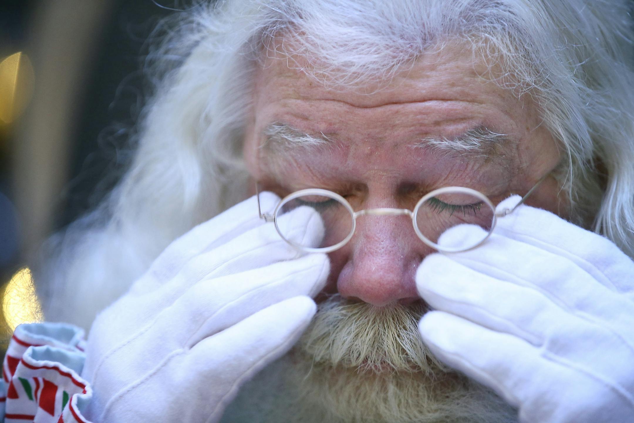 "Santa" wiped tears from his eyes as he remembered some of his favorite and sad stories from his years of meeting children at the North Pole at the Mall of America, Thursday, December 3, 2015 in Bloomington, MN.