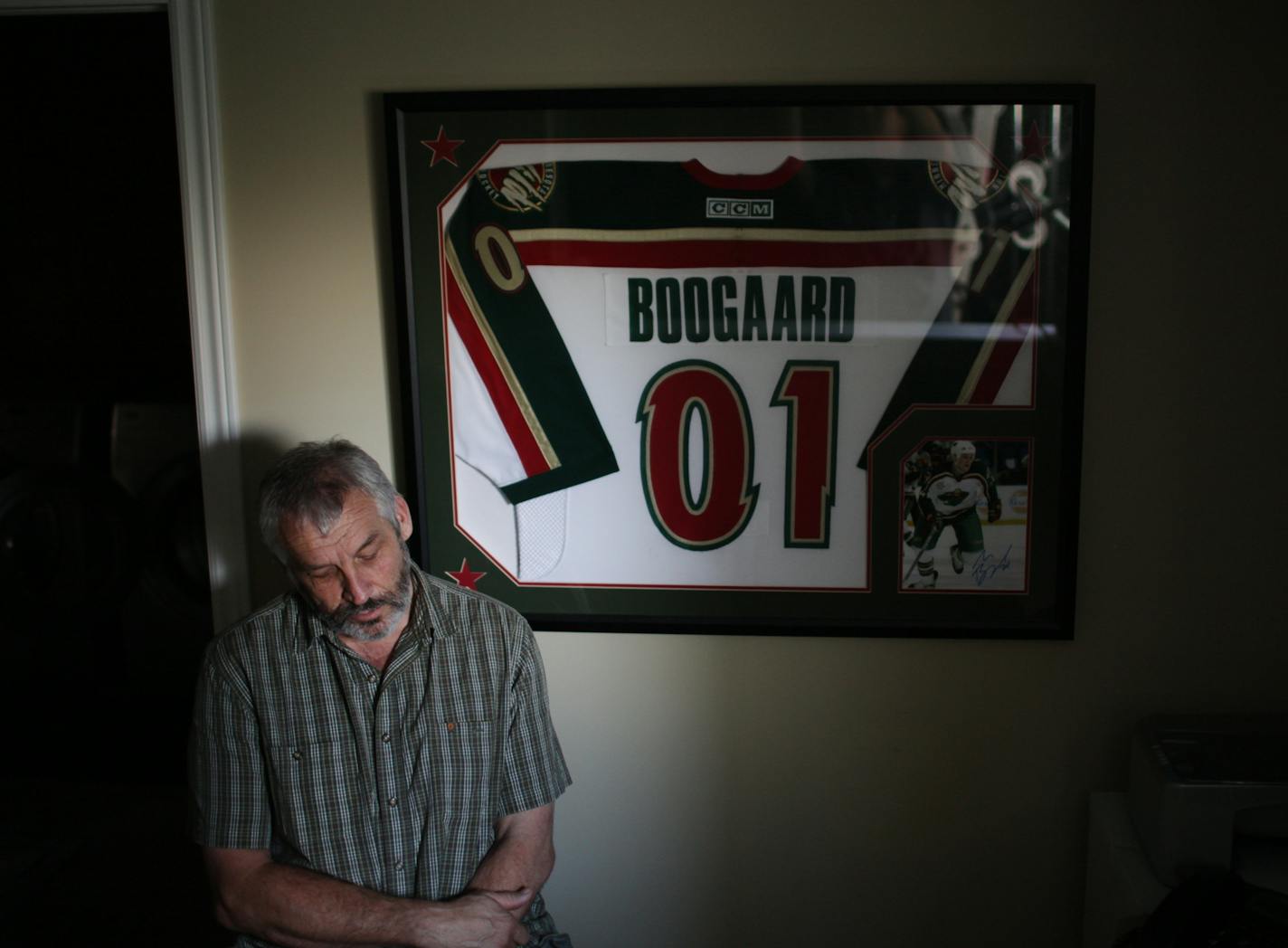 Len Boogaard, who encouraged his son Derek Boogaard's hockey career, next to Derek's jersey, in Ottawa, Ontario, Canada, Aug. 30, 2011.