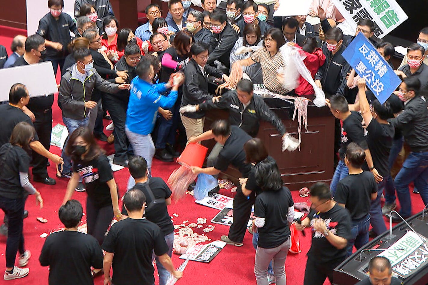 Lawmakers fought during a parliament session in Taipei, Taiwan, Friday, Nov. 27, 2020.