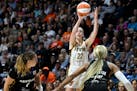 Indiana Fever guard Caitlin Clark puts up a three-pointer against the Connecticut Sun during the fourth quarter Tuesday night in Uncasville, Conn.