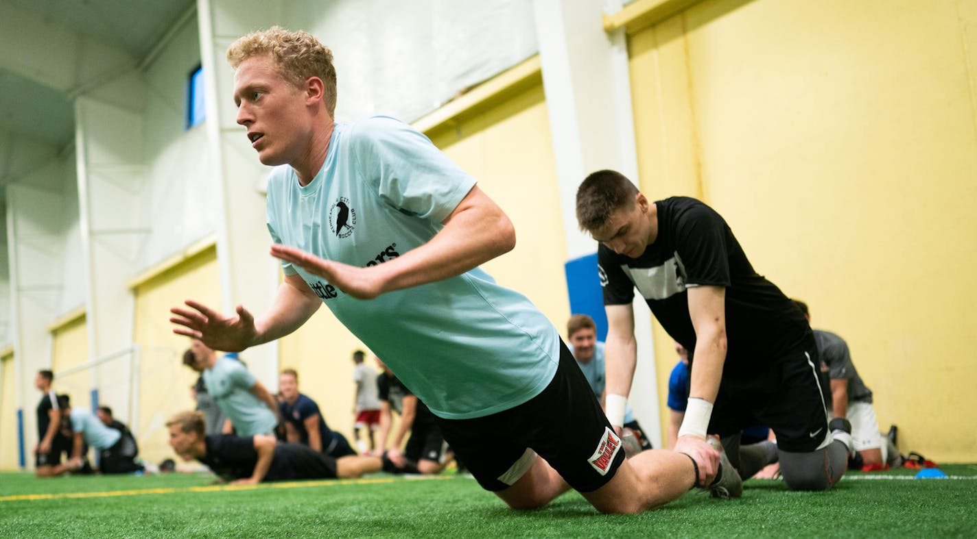 Minneapolis City foreword Will Kidd warms up with teammates before practice. ] MARK VANCLEAVE ¥ The Minneapolis City held an evening practice Monday, Jun 24, 2019 in Eden Prairie. The 9:00 to 11:00 practice is scheduled to allow players to work their day jobs.