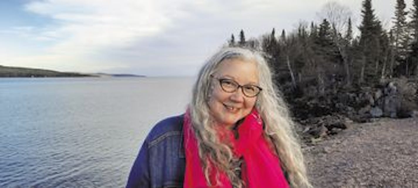 photo of author Staci Lola Drouillard near a lake