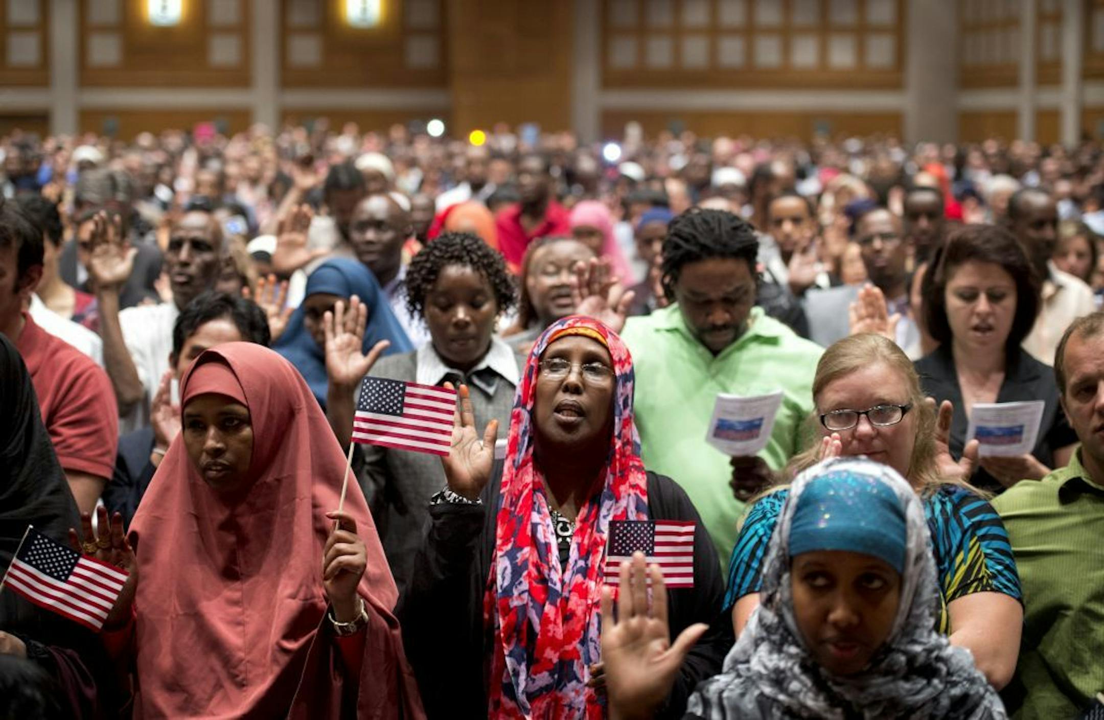 Sept. 6, 2012: Somali immigrants take the citizenship oath. Around 1,500 immigrants from 100 different countries were sworn in as new U.S. citizens at the Minneapolis Convention Center.