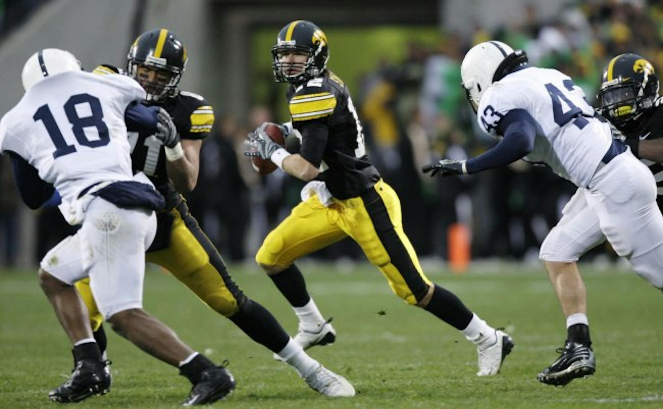Iowa quarterback Ricky Stanzi, center, looks to pass during the second half of this NCAA college football game against Penn State, Saturday, Nov. 8, 2008, in Iowa City, Iowa. Iowa won 24-23.