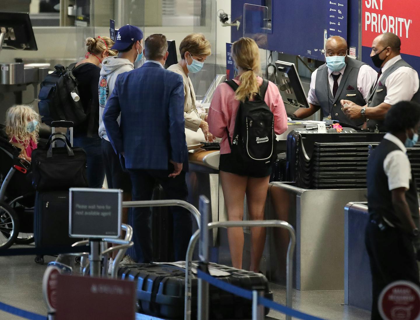 Travelers at the Delta Air Lines ticketing counter Thursday at Minneapolis-St. Paul International Airport.