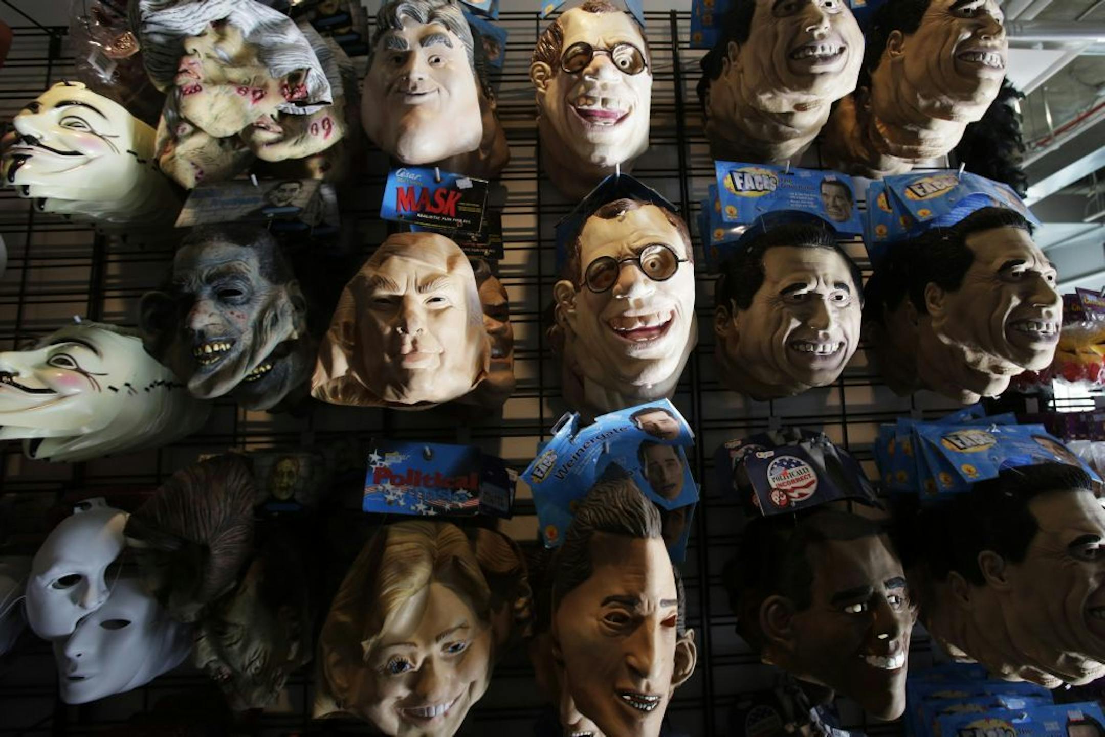 Latex Halloween masks are displayed in a costume store, Tuesday, Oct. 8, 2013 in New York. Halloween is Oct. 31.
