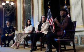 Singer-songwriter Aloe Blacc speaks, right, speaks during an event on the White House complex in Washington, Tuesday, April 23, 2024, with notable sui