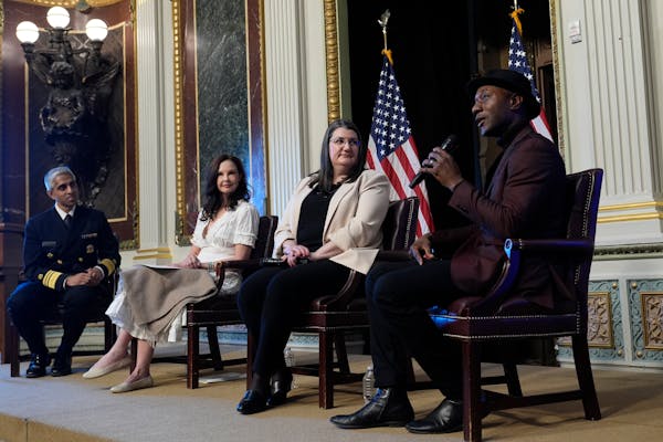 Singer-songwriter Aloe Blacc speaks, right, speaks during an event on the White House complex in Washington, Tuesday, April 23, 2024, with notable sui