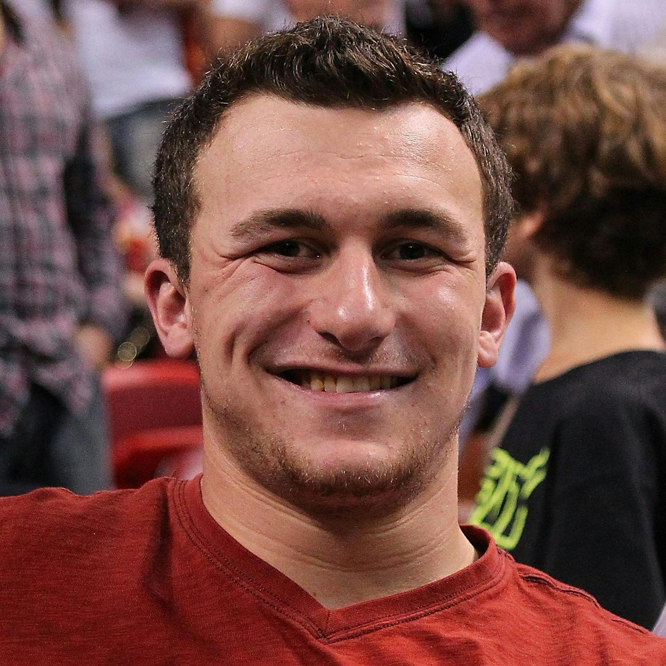 Texas A&M quarterback from Johnny Manziel poses for a picture during an NBA game between the Golden State Warriors and the Miami Heat at AmericanAirlines Arena in Miami on Thursday, Jan. 2, 2014. (David Santiago/El Nuevo Herald/MCT) ORG XMIT: 1147438