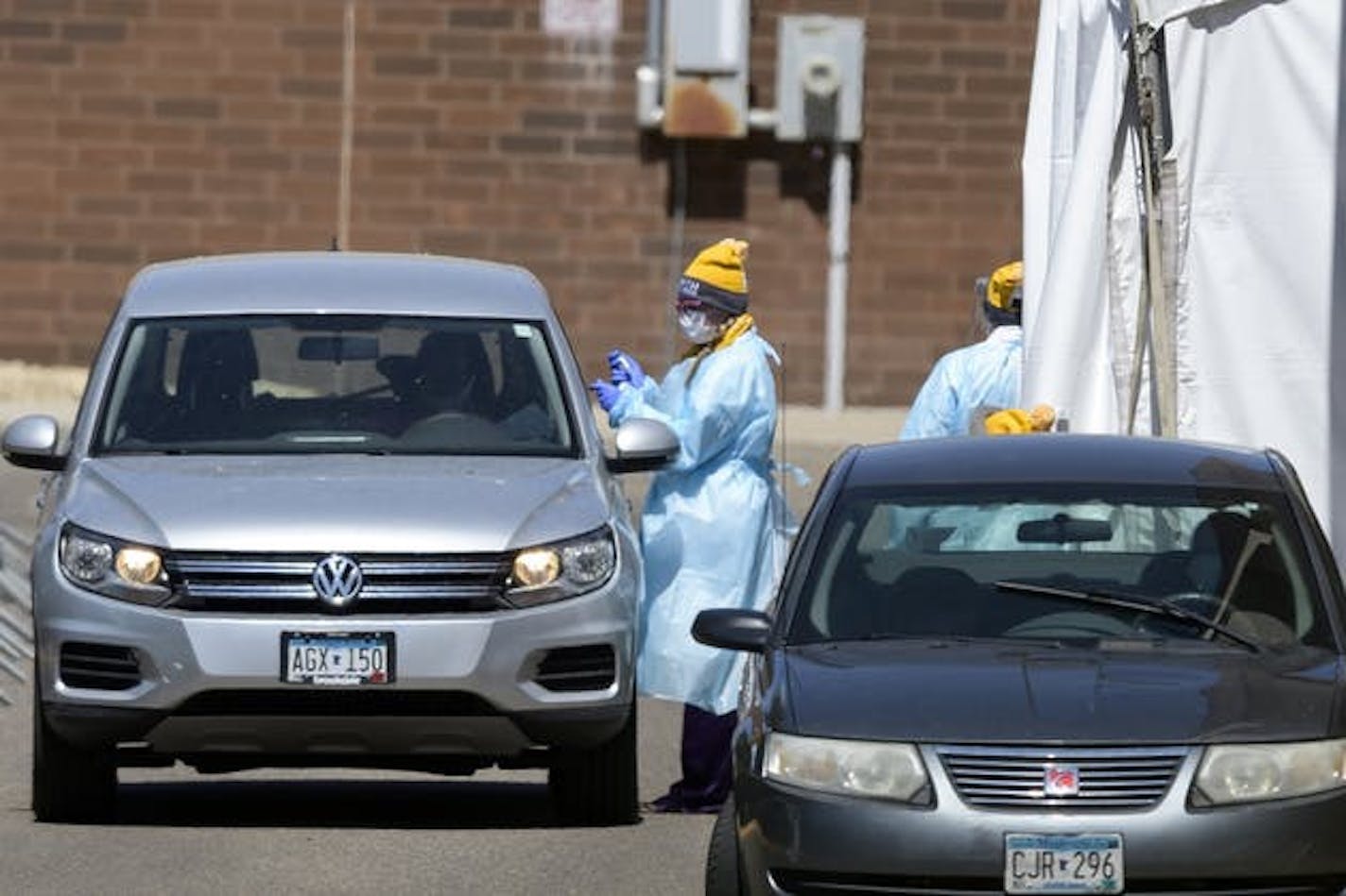 Photo by Aaron Lavinsky: Medical workers provided drive-up COVID-19 tests on Friday at North Memorial Health Hospital in Robbinsdale.