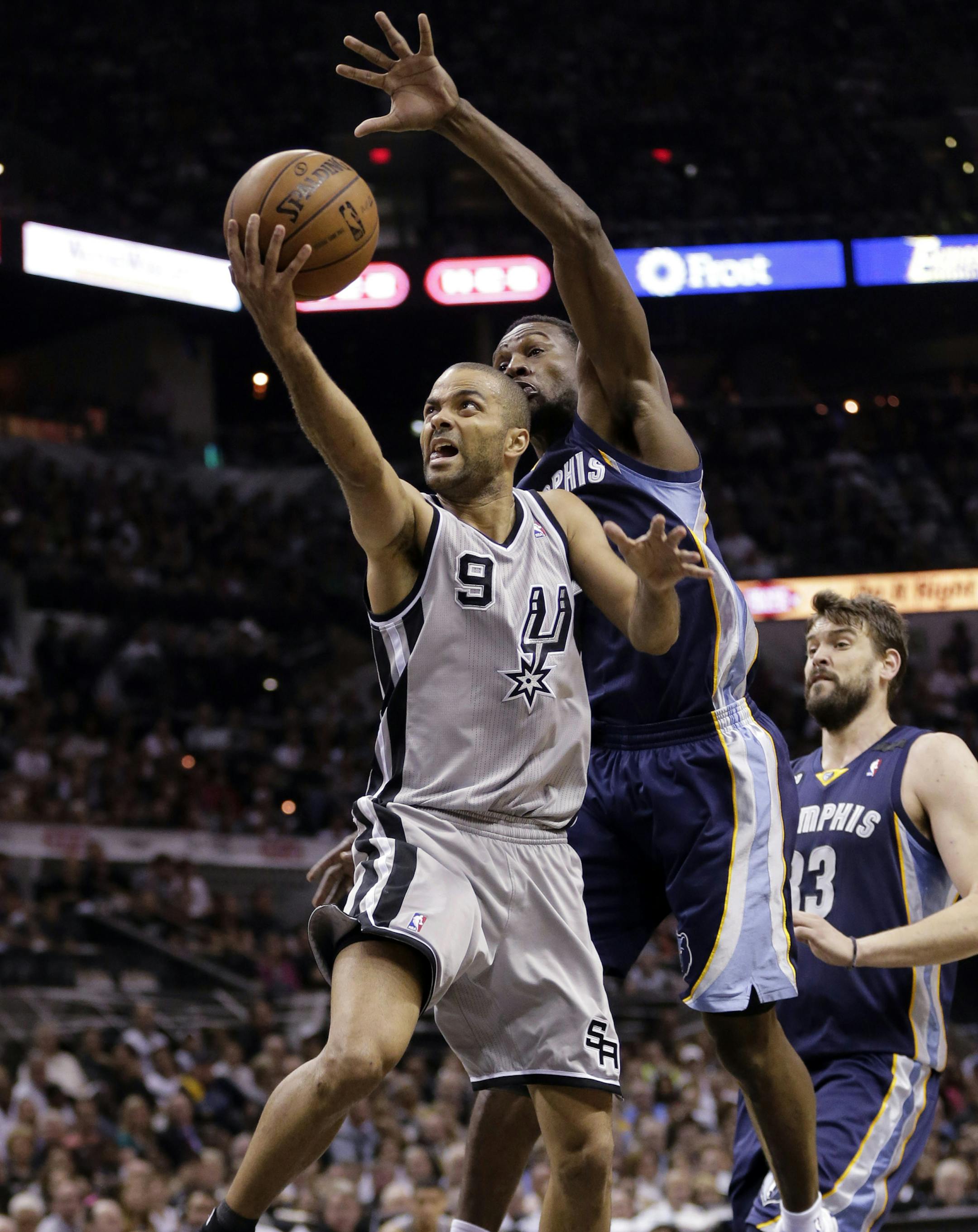 San Antonio Spurs' Tony Parker (9), of France, shoots as Memphis Grizzlies' Tony Allen, right, reached over to defend him during the first half in Game 1 of a Western Conference Finals NBA basketball playoff series, Sunday, May 19, 2013, in San Antonio. (AP Photo/Eric Gay)