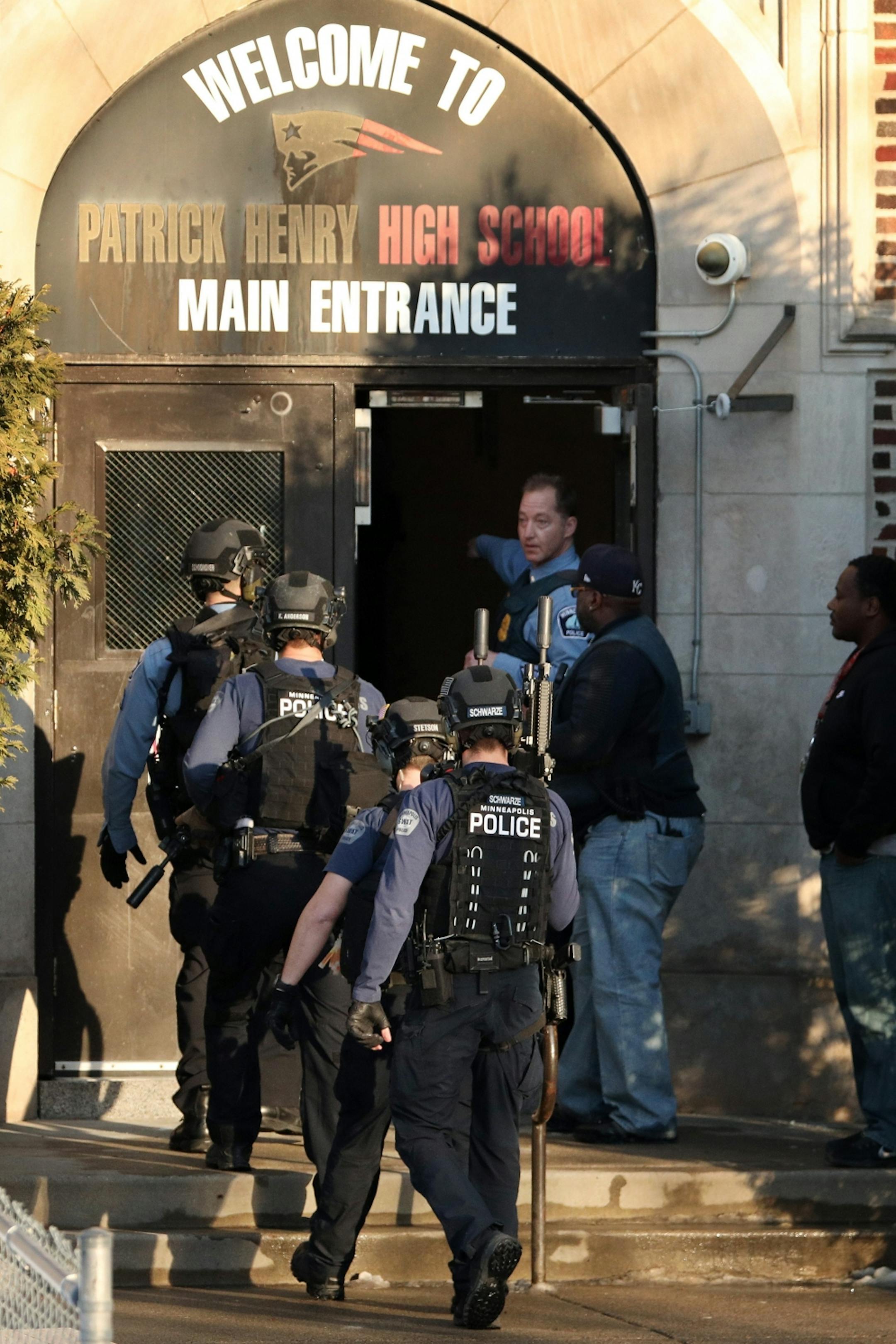 Police in tactical gear entered Patrick Henry High School after a gunman was reported getting off a Metro Transit bus near the school Tuesday.