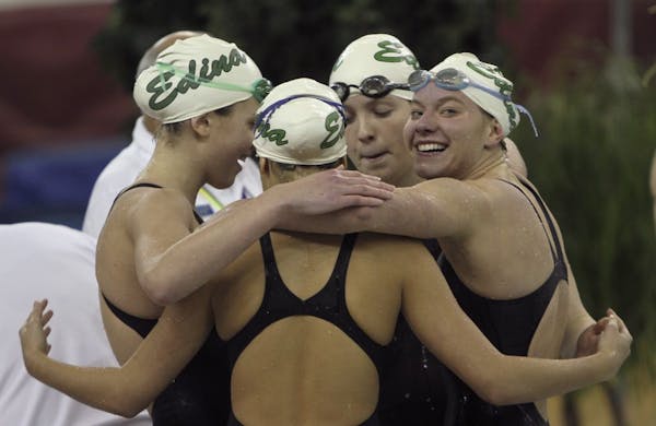 Edina's Nikki Larson looked back at fans Saturday as she celebrated her victory and record in the 200-yard freestyle relay in the girls' swimming and 