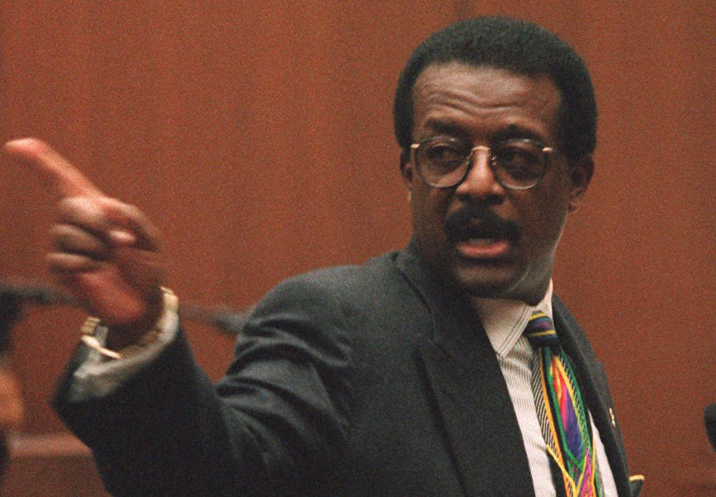 Defense attorney Johnnie Cochran Jr. points Wednesday, Sept. 27, 1995, to courtroom doors at the Los Angeles Criminal Courts Building that he says double-murder defendant O.J. Simpson will walk out of if found not guilty.