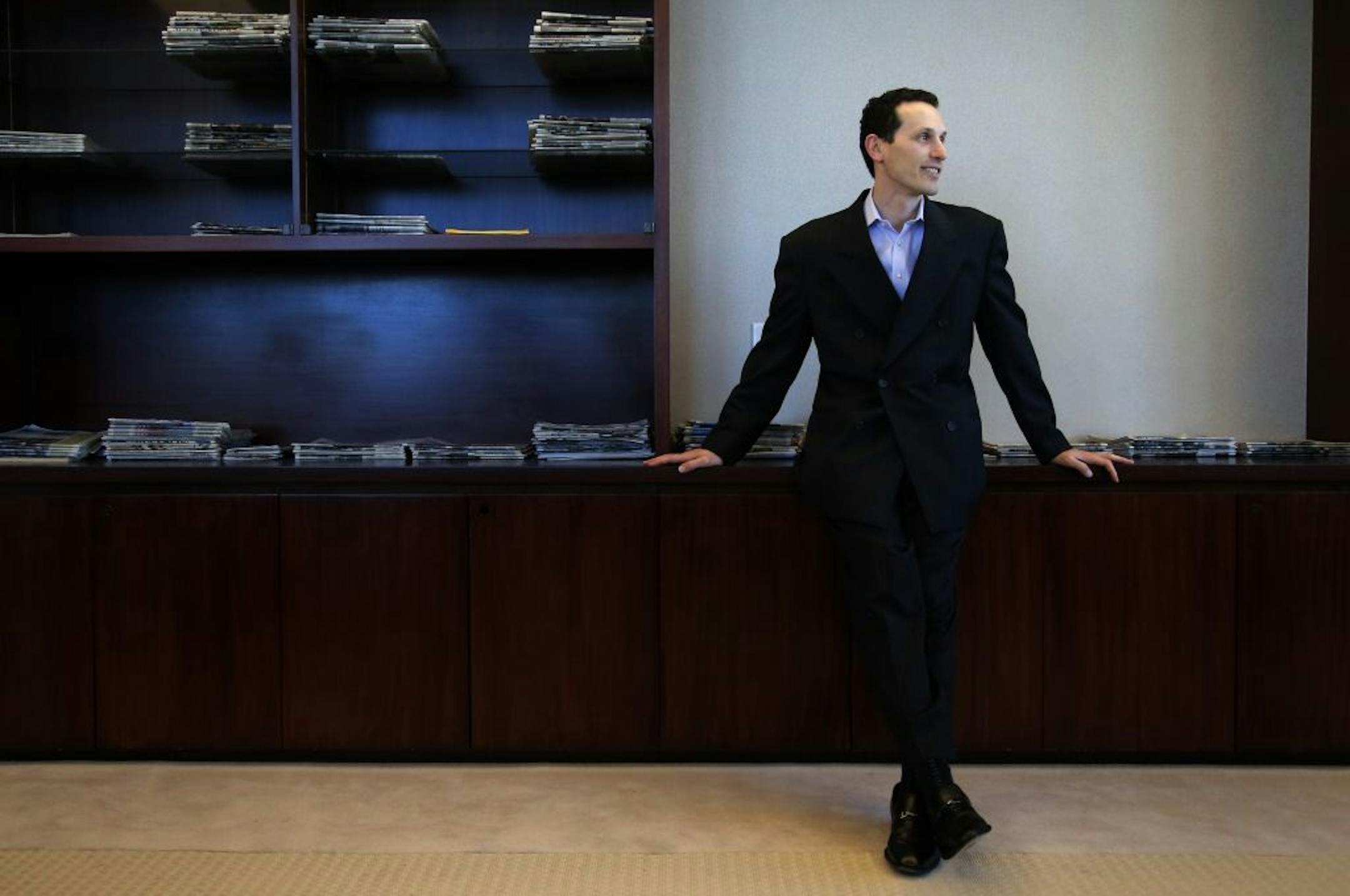 Aaron Kushner, publisher of The Orange County Register, pauses for photos in his office in Santa Ana, Calif., Thursday, Dec. 27, 2012. After years of demoralizing layoffs, one newspaper is trying something novel: hiring more reporters. The Orange County Register�s new owner thinks the way to turn the paper around is through better reporting to lure new and former readers to a revived product.