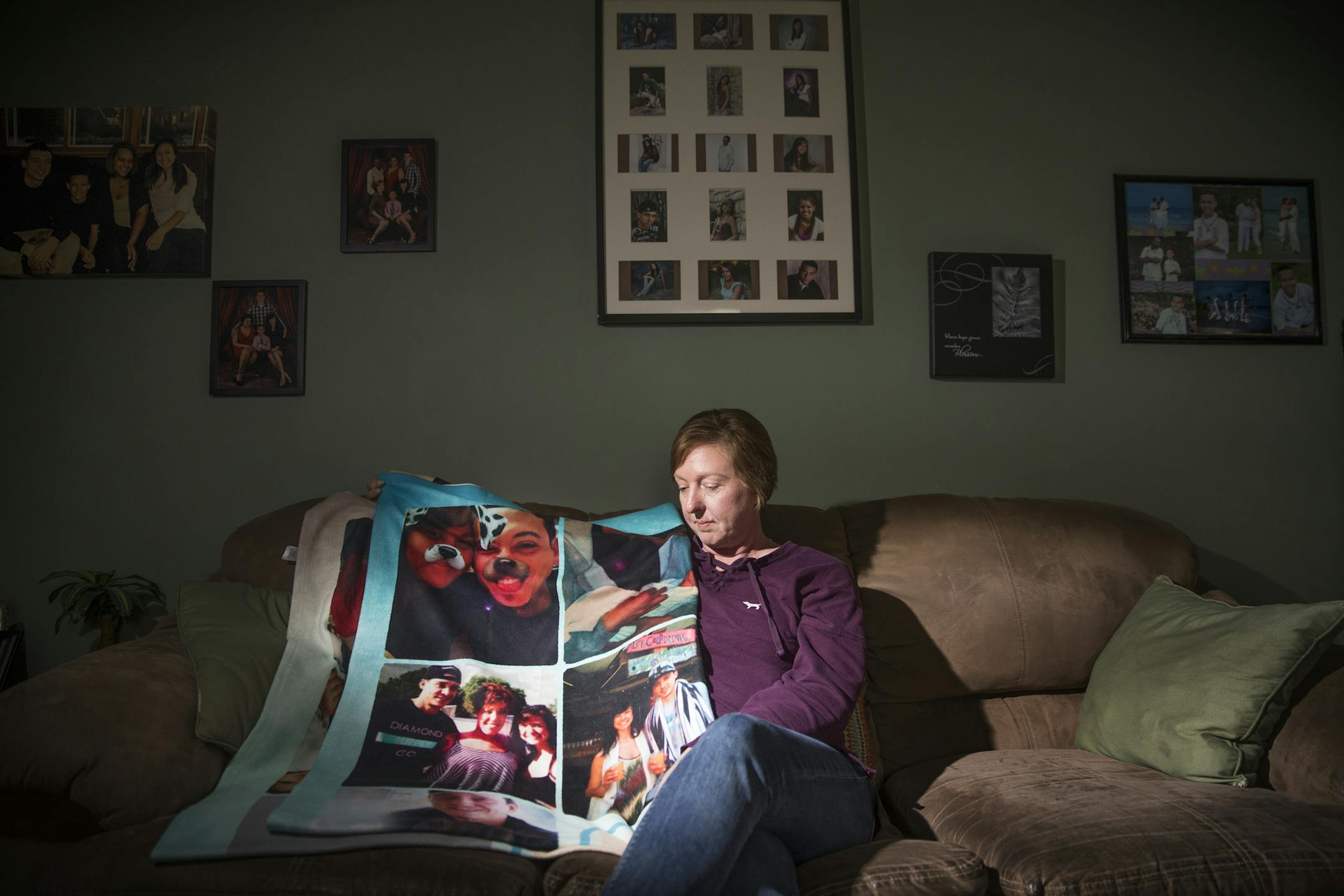 Nicole Smith-Holt poses for a photo at home with a blanket that was gifted to her and was made in memory of her son Alec Smith. ] LEILA NAVIDI • leila.navidi@startribune.com BACKGROUND INFORMATION: Nicole Smith-Holt photographed at home in Richfield on Thursday, May 10, 2018. When her son Alec Smith turned 26 and rolled off his parents' health insurance last June, he couldn't afford his own plan, so instead he went uninsured and rationed his remaining insulin for type 1 diabetes because h