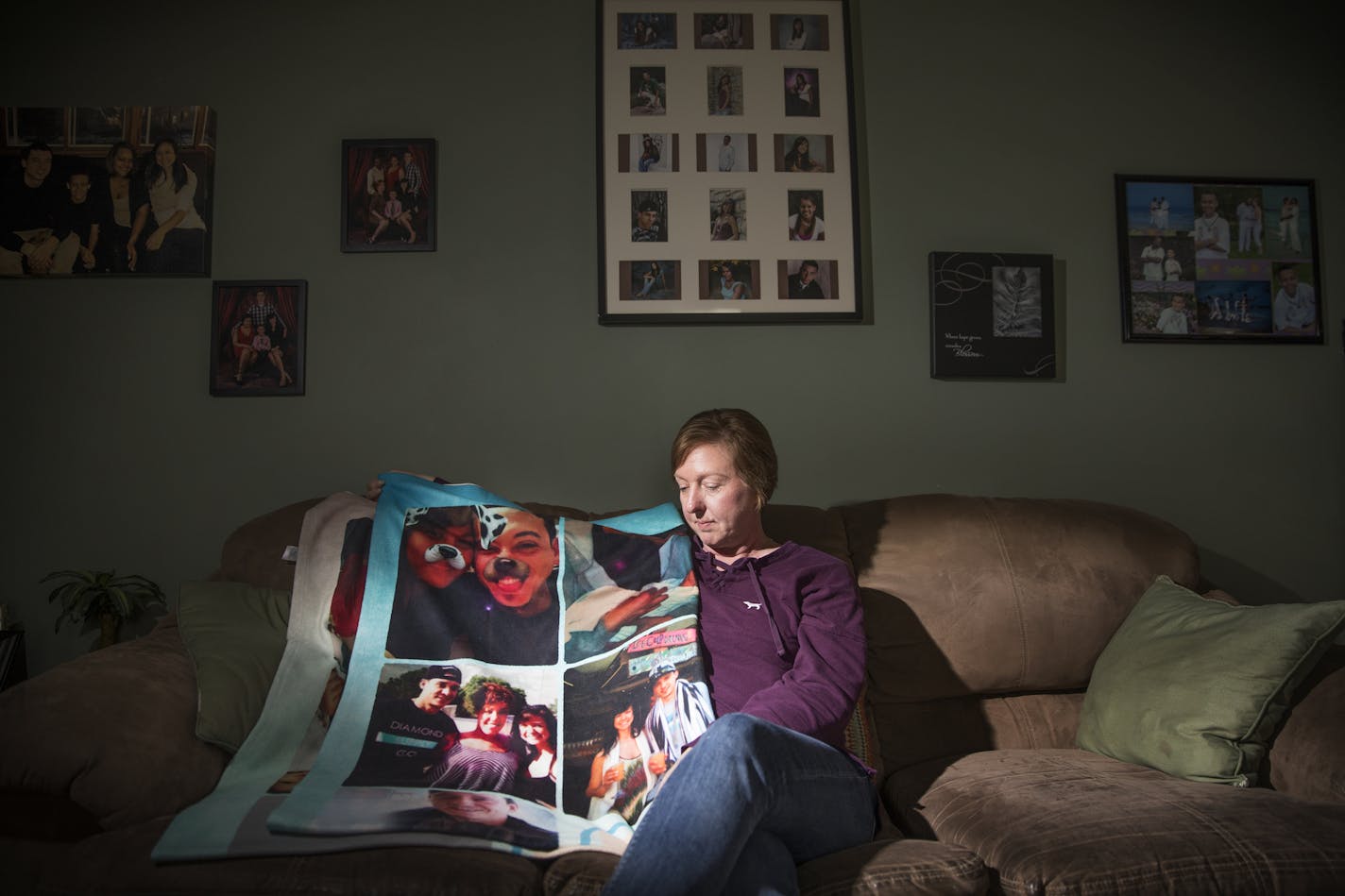 Nicole Smith-Holt poses for a photo at home with a blanket that was gifted to her and was made in memory of her son Alec Smith. ] LEILA NAVIDI &#x2022; leila.navidi@startribune.com BACKGROUND INFORMATION: Nicole Smith-Holt photographed at home in Richfield on Thursday, May 10, 2018. When her son Alec Smith turned 26 and rolled off his parents' health insurance last June, he couldn't afford his own plan, so instead he went uninsured and rationed his remaining insulin for type 1 diabetes because h