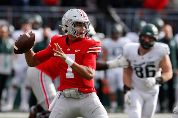 Ohio State quarterback C.J. Stroud drops back to pass against Michigan State during the first half of an NCAA college football game Saturday, Nov. 20,